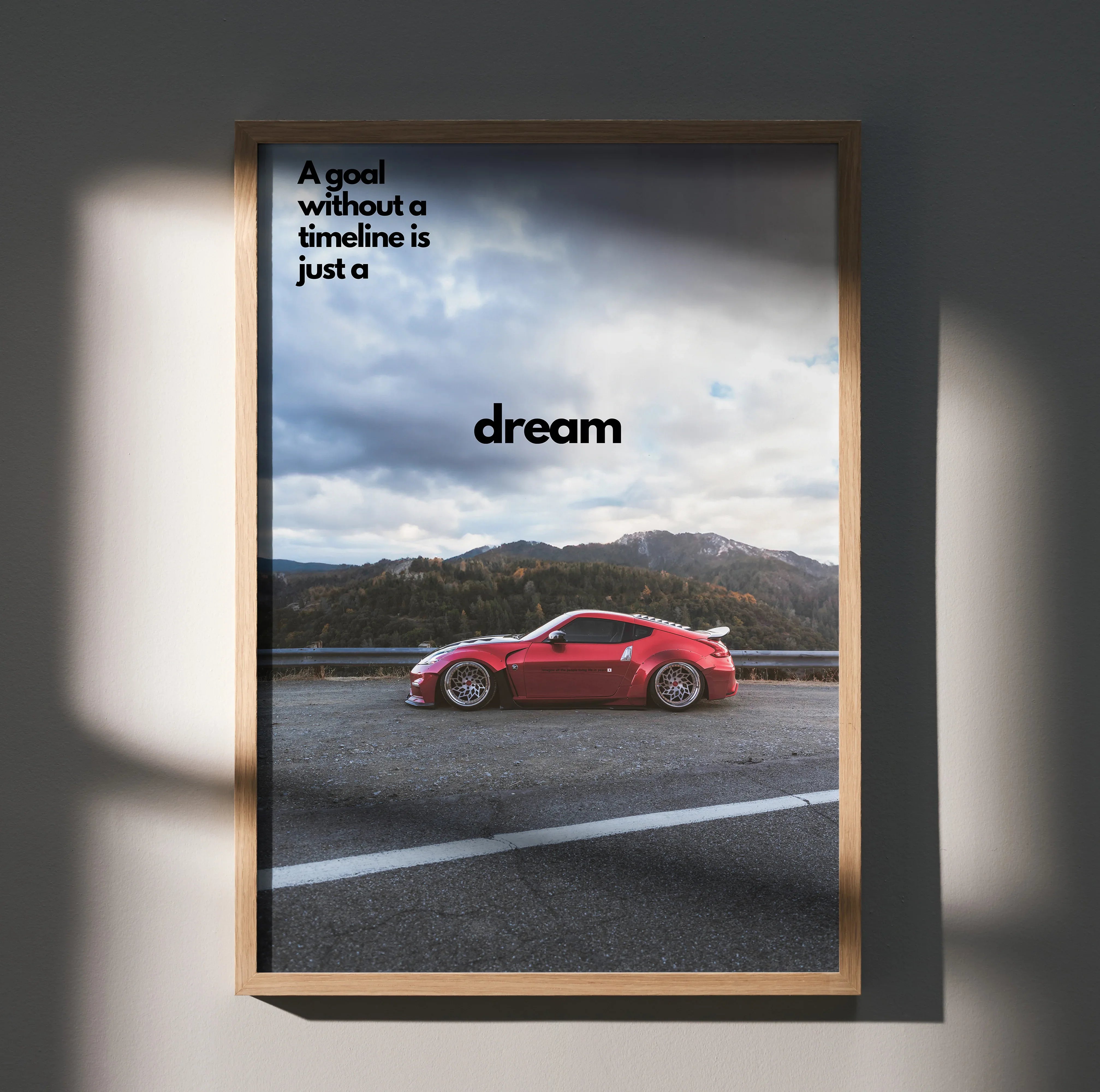 Motivational poster wall art featuring red Nissan 370z on open road with inspiring text.