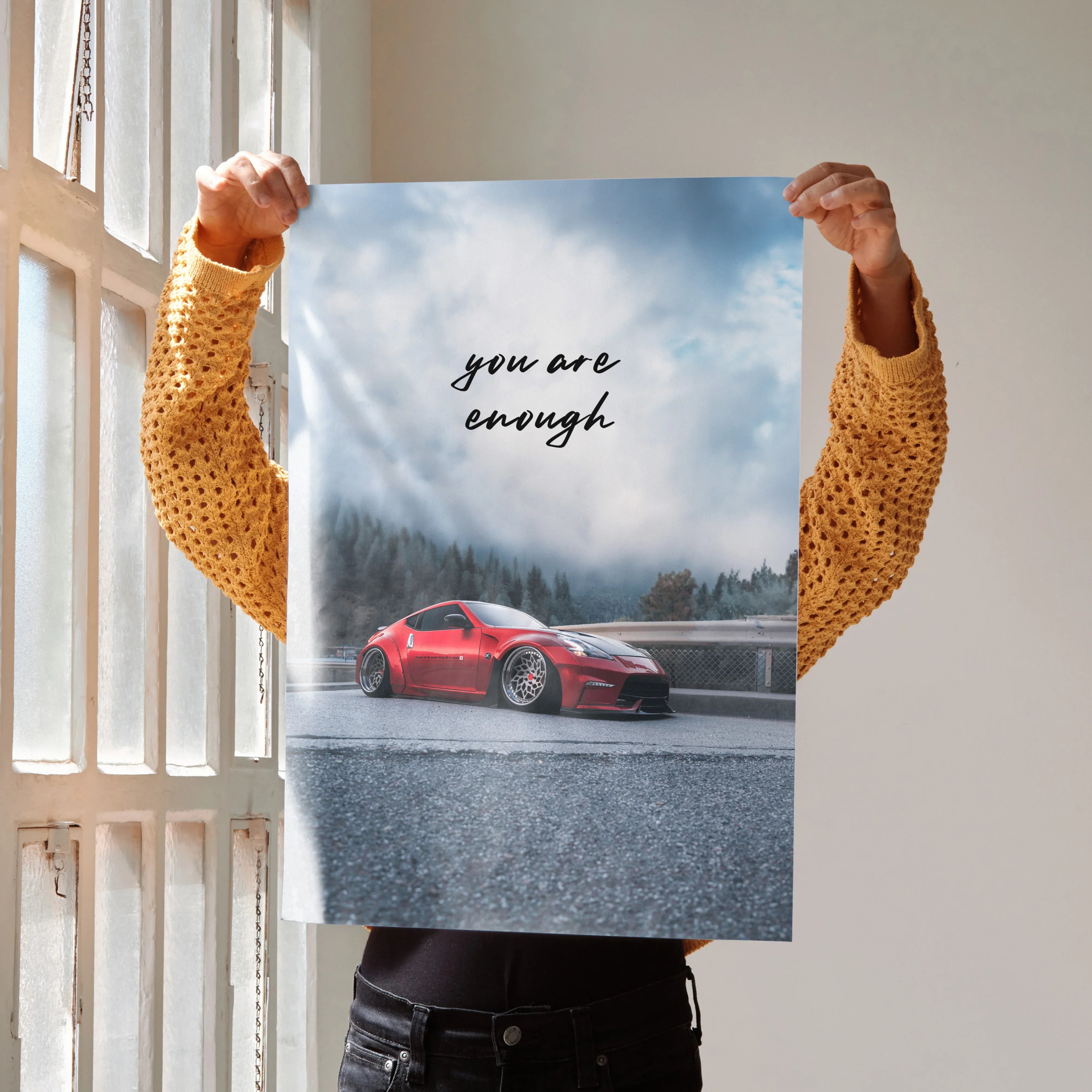 Motivational poster wall art with red Nissan 370z on wet road and "you are enough" text.
