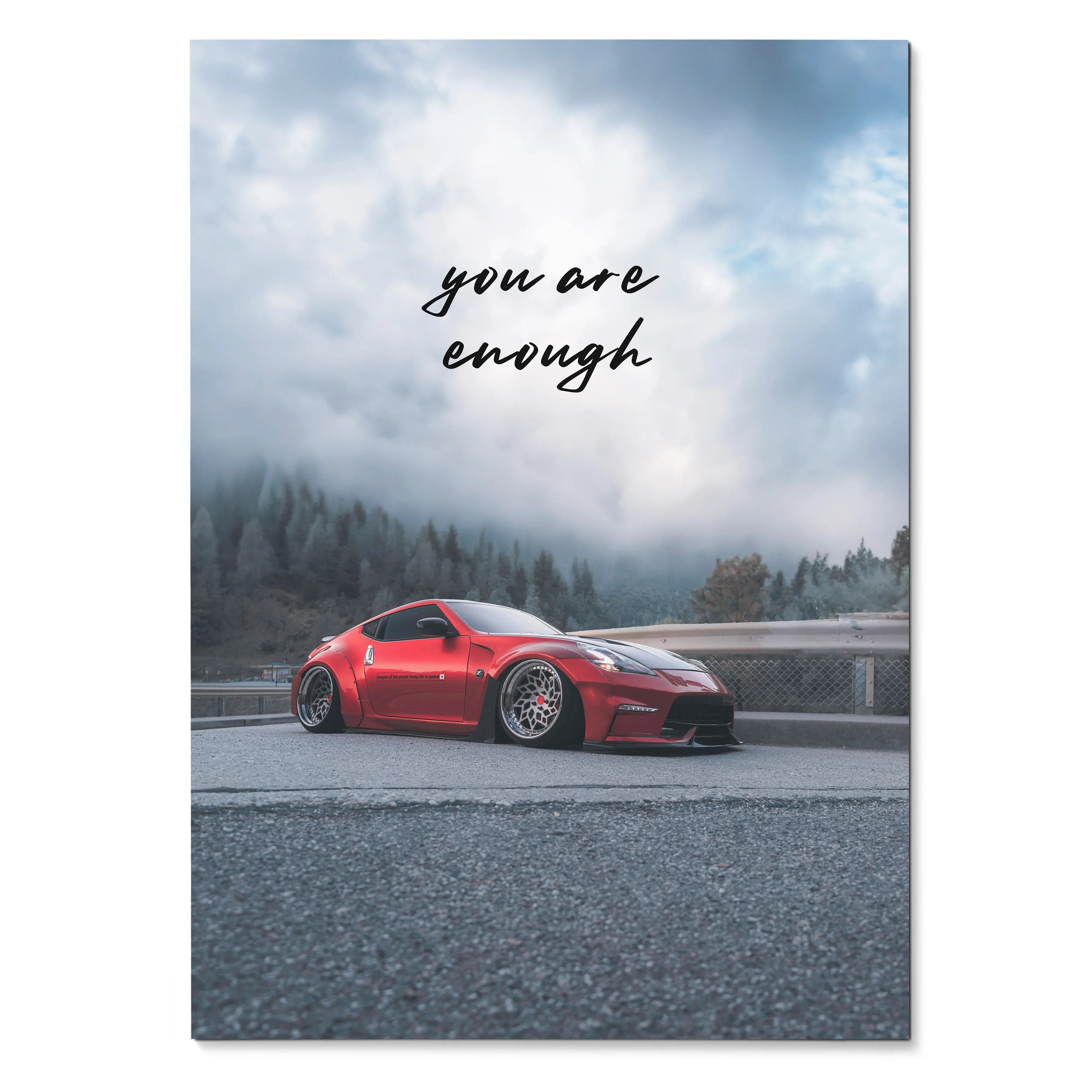 Poster wall art featuring a red Nissan 370z on a misty road with "you are enough" text.