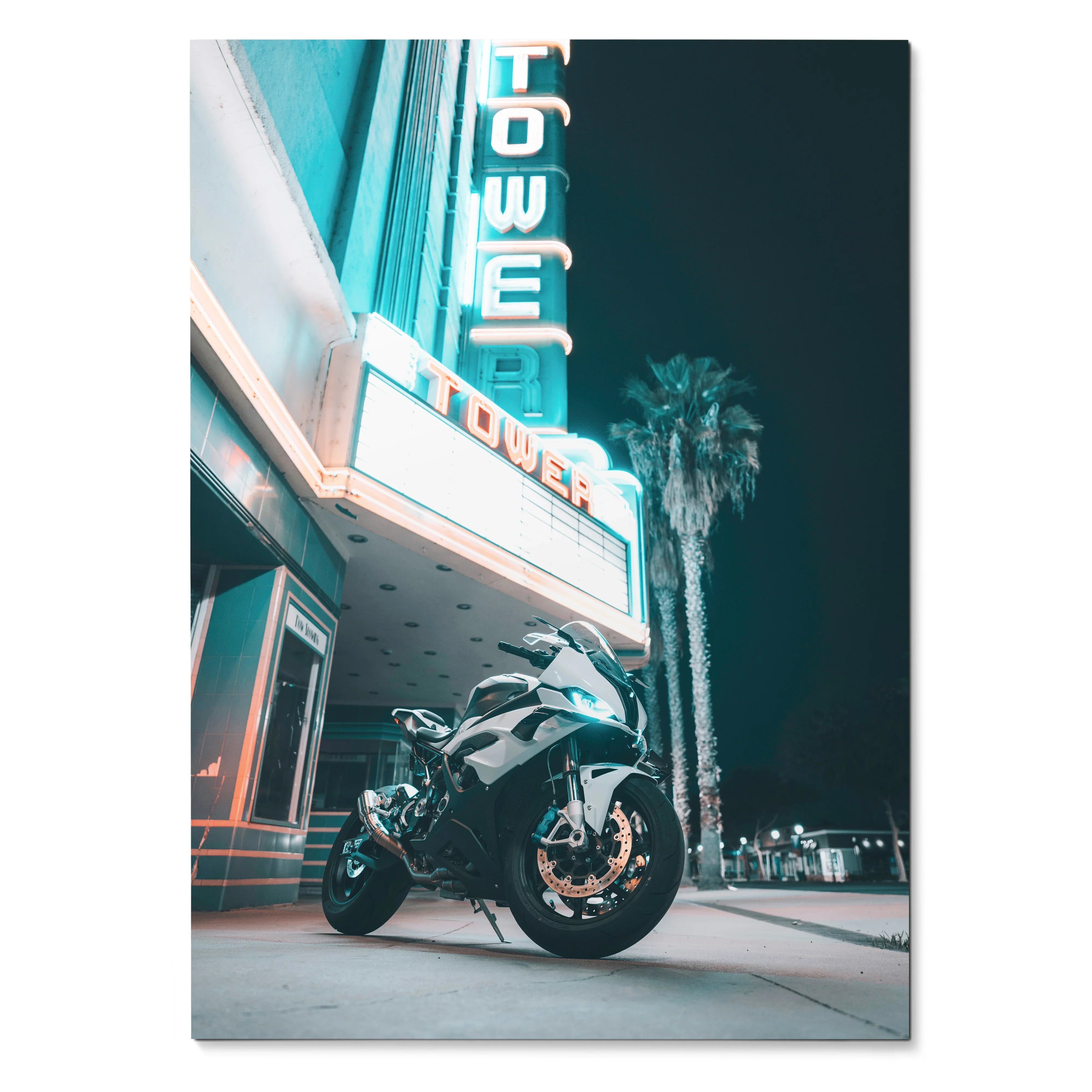 BMW S1000RR motorcycle parked at night under lit theater sign poster wall art.