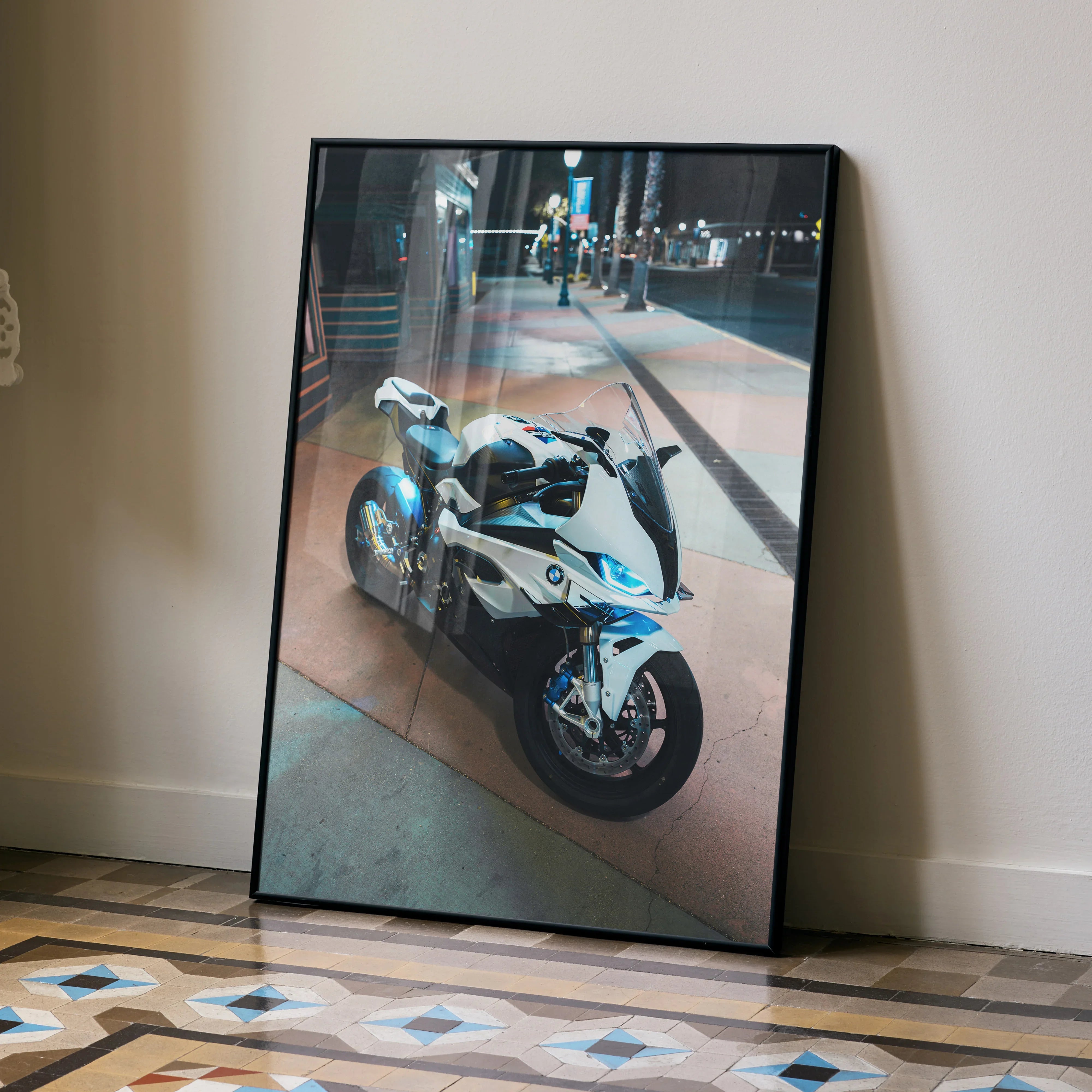 BMW S1000RR motorcycle poster leaning against wall, modern urban night scene wall art.