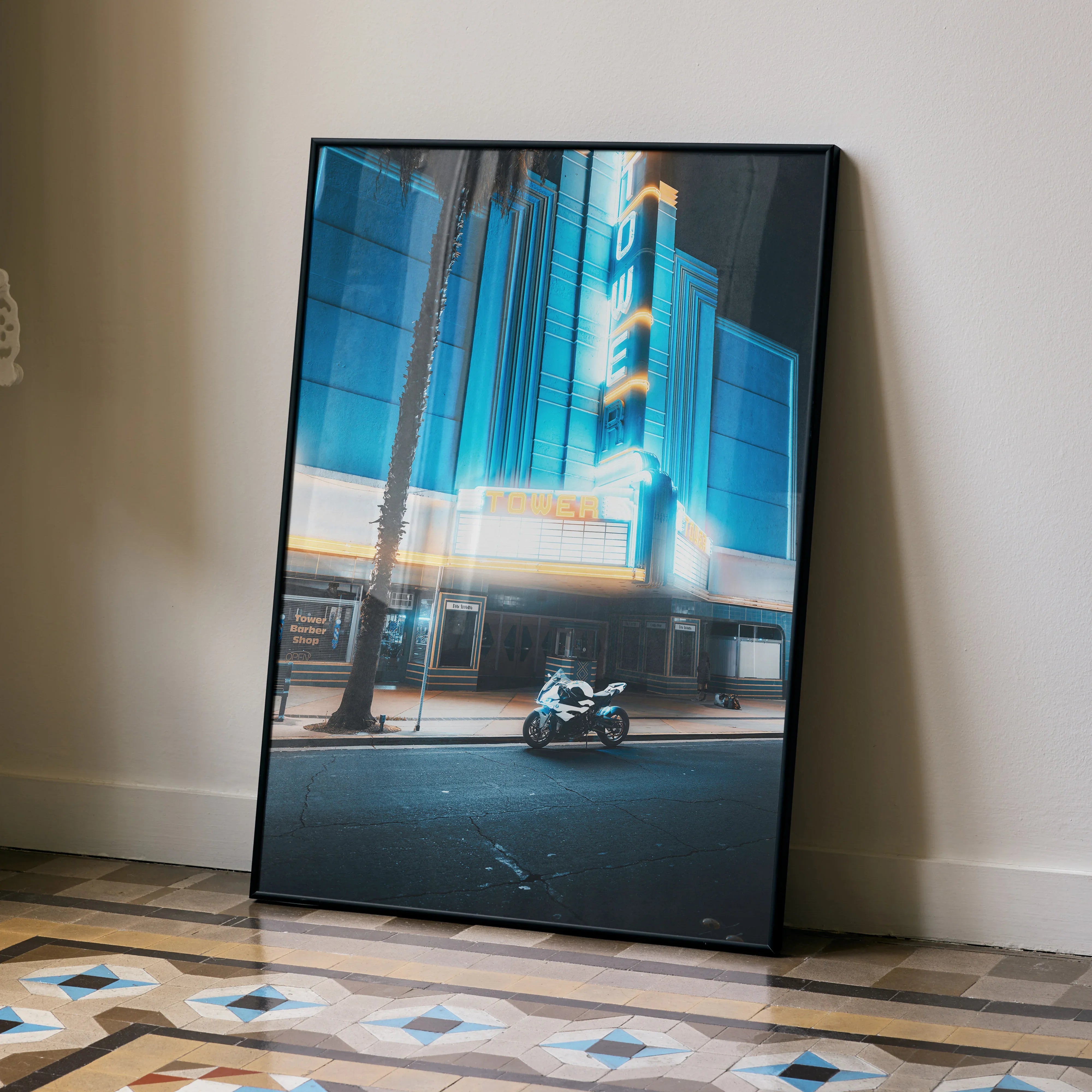 BMW S1000RR motorcycle illuminated outside neon-lit theater poster wall art print.