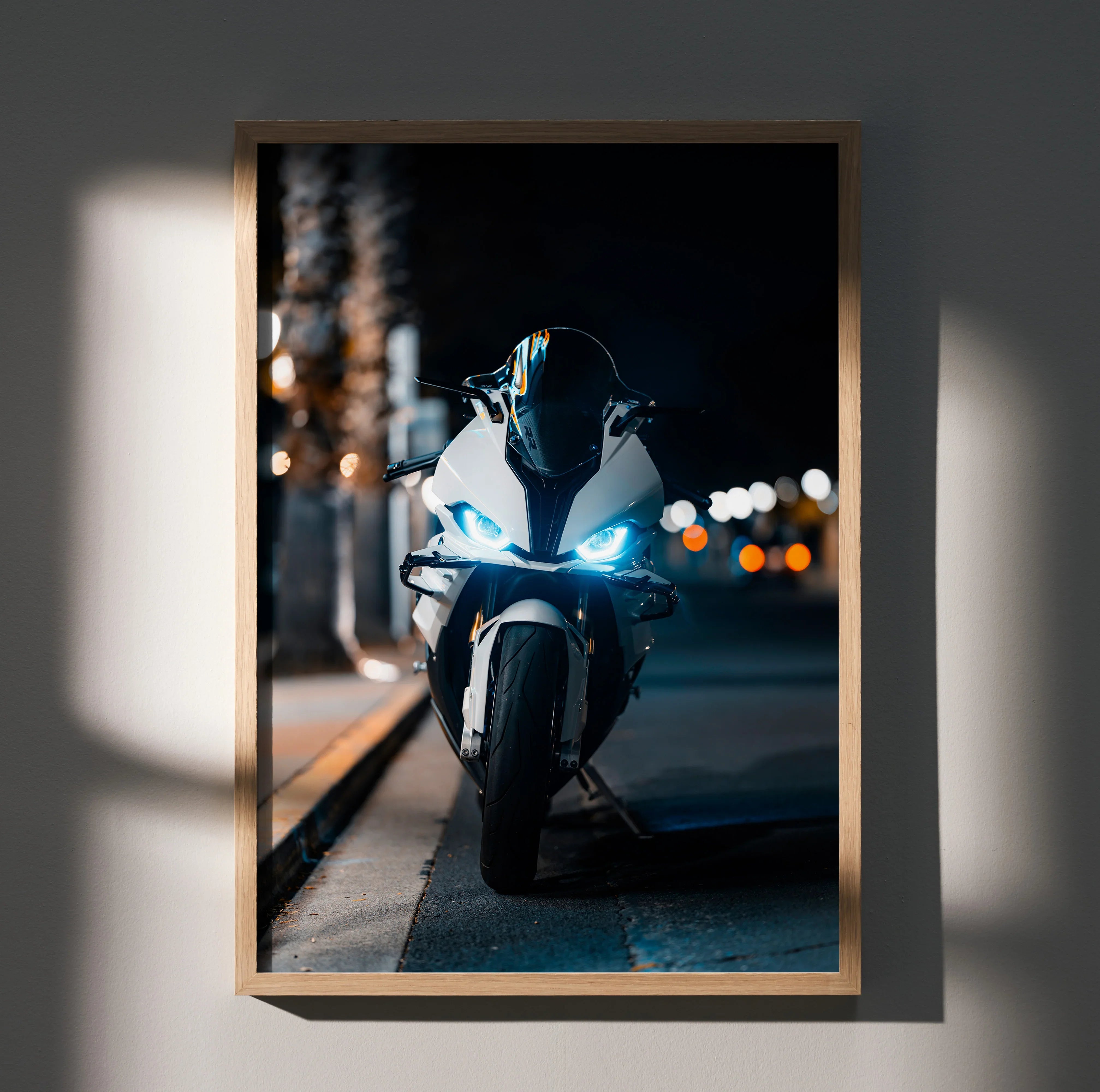 BMW S1000RR motorcycle wall art poster with illuminated headlights in dark urban setting.
