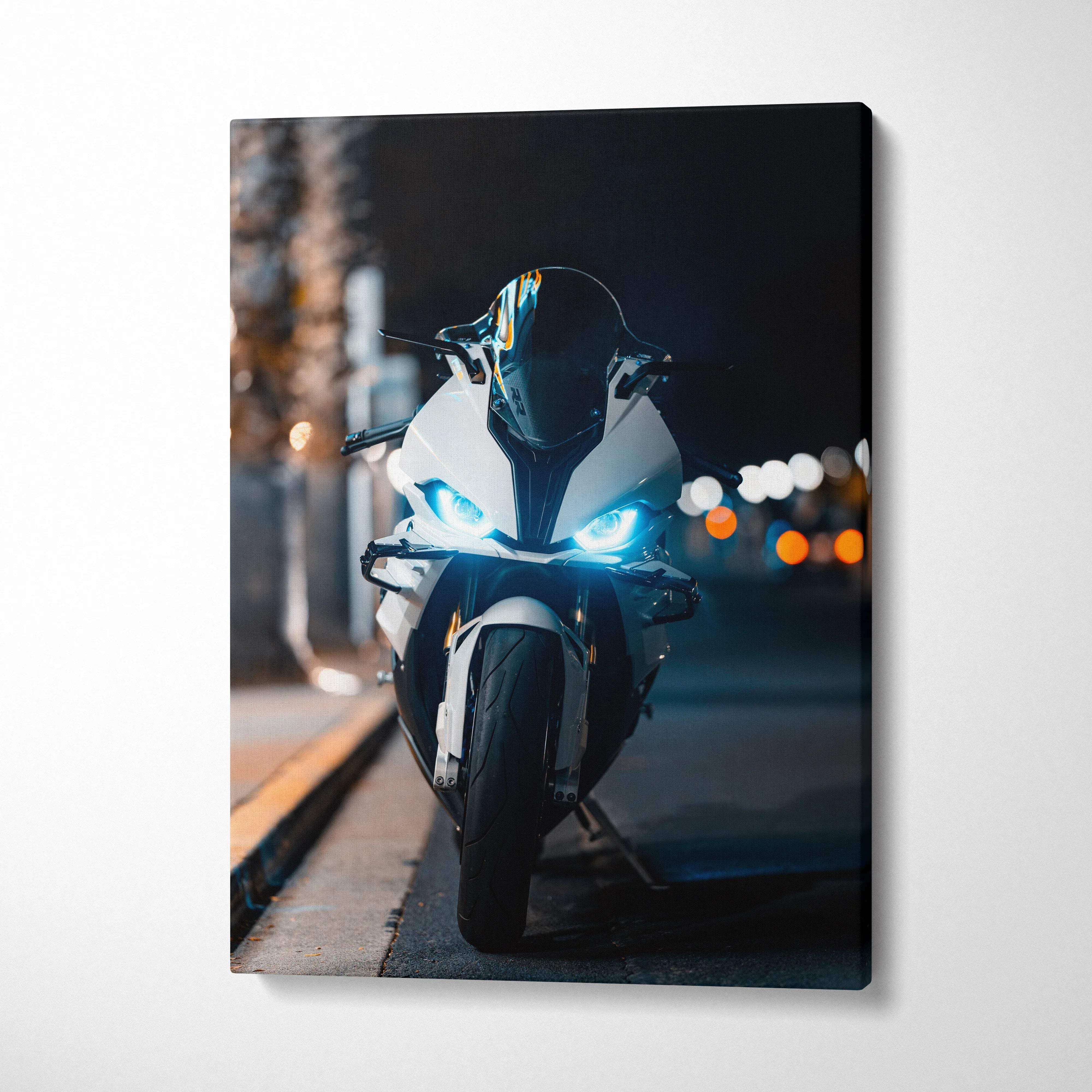 BMW S1000RR motorcycle canvas art with glowing headlights on urban street at night wall art.