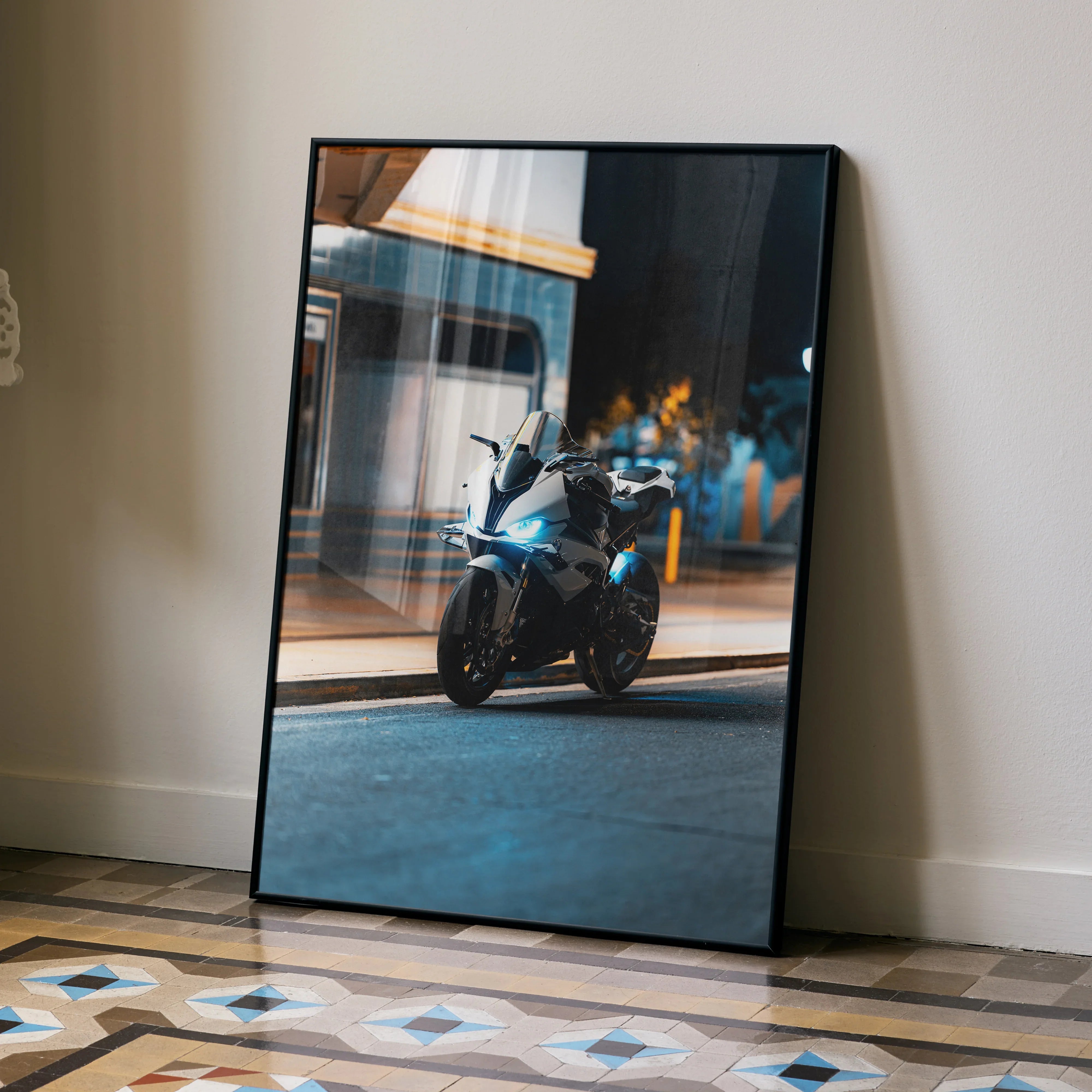 BMW S1000RR motorcycle poster with nighttime urban scene wall art in black frame.