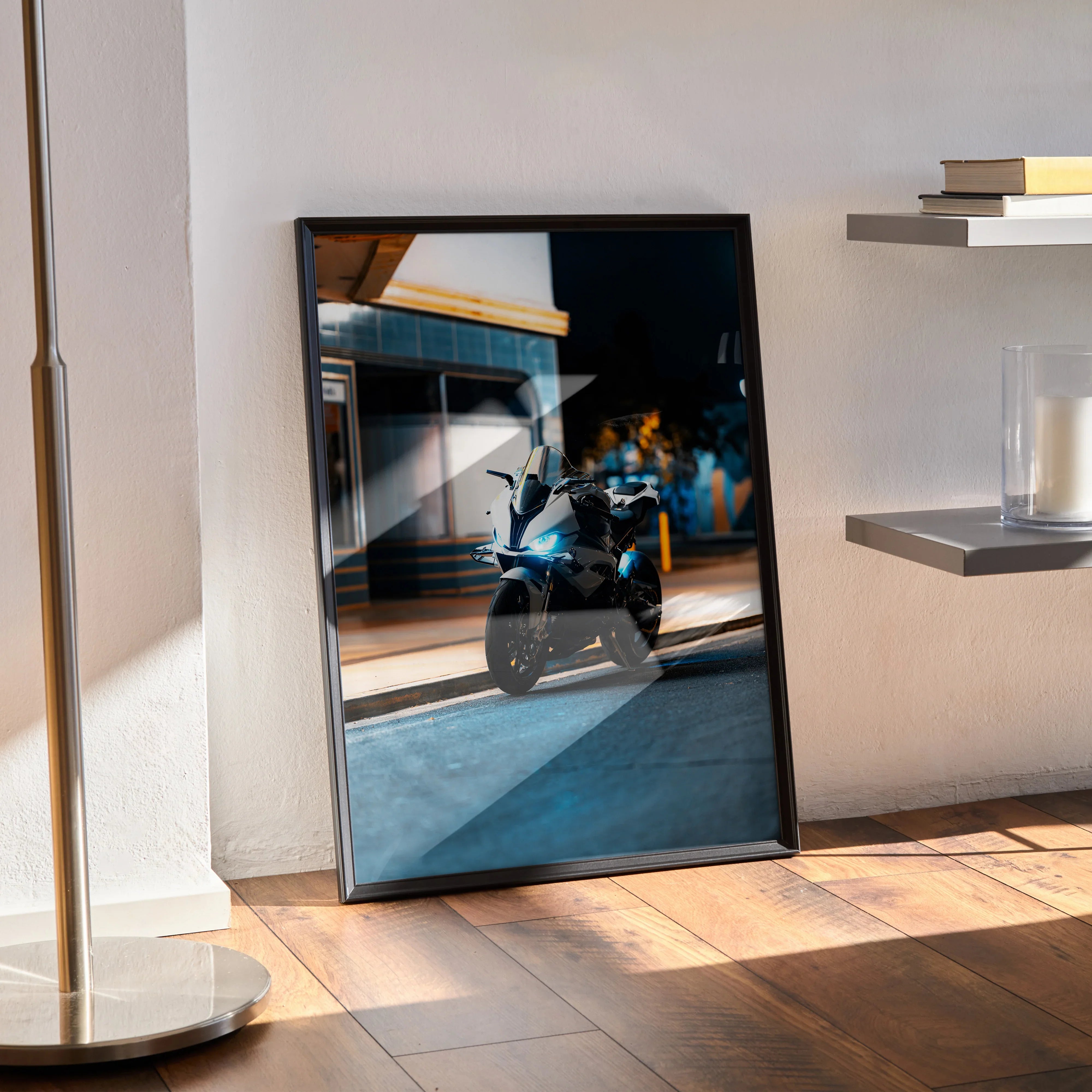 BMW S1000RR motorcycle poster wall art with sleek black frame, leaning against white wall on wooden floor.