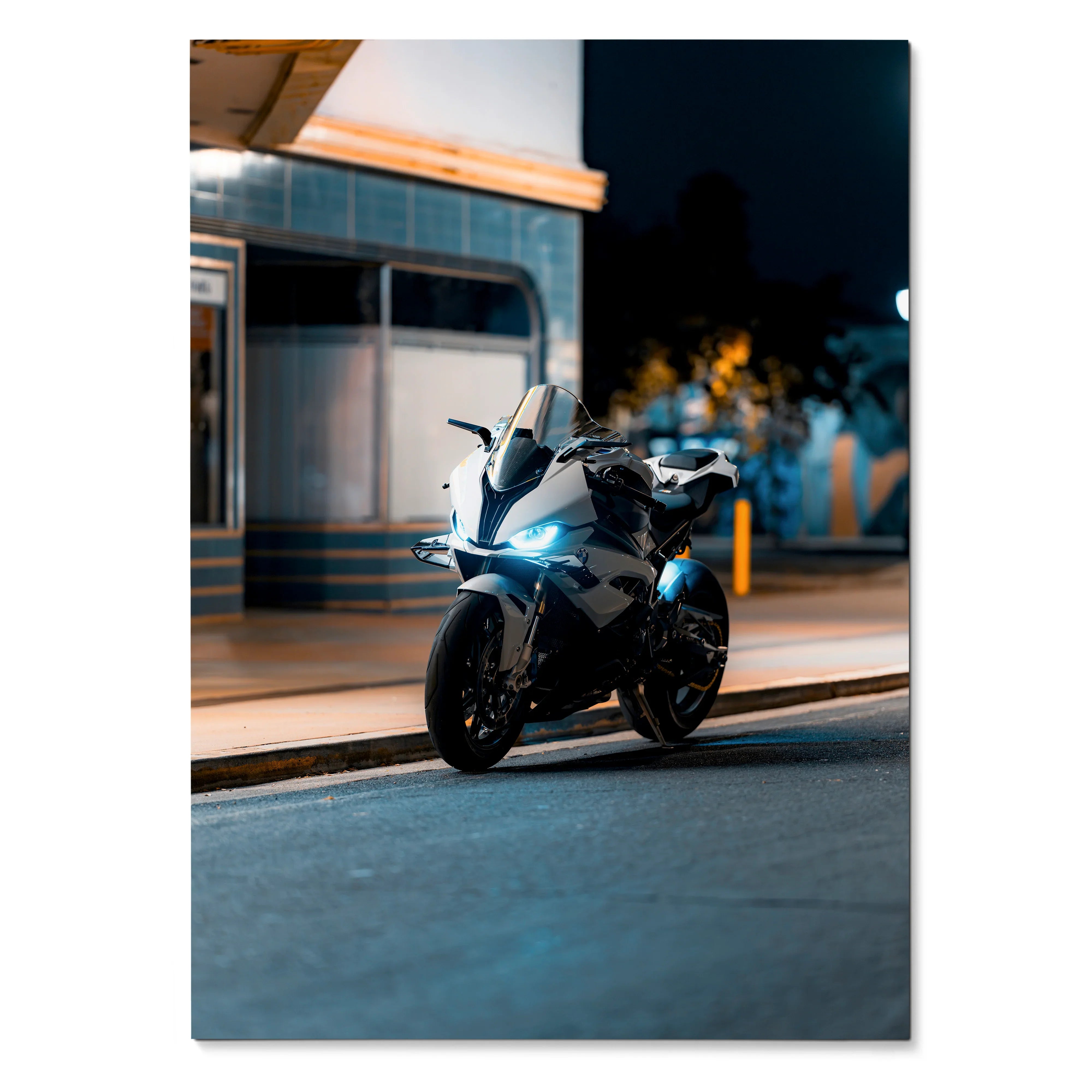 BMW S1000RR motorcycle parked at night glowing with blue accent lights poster wall art.