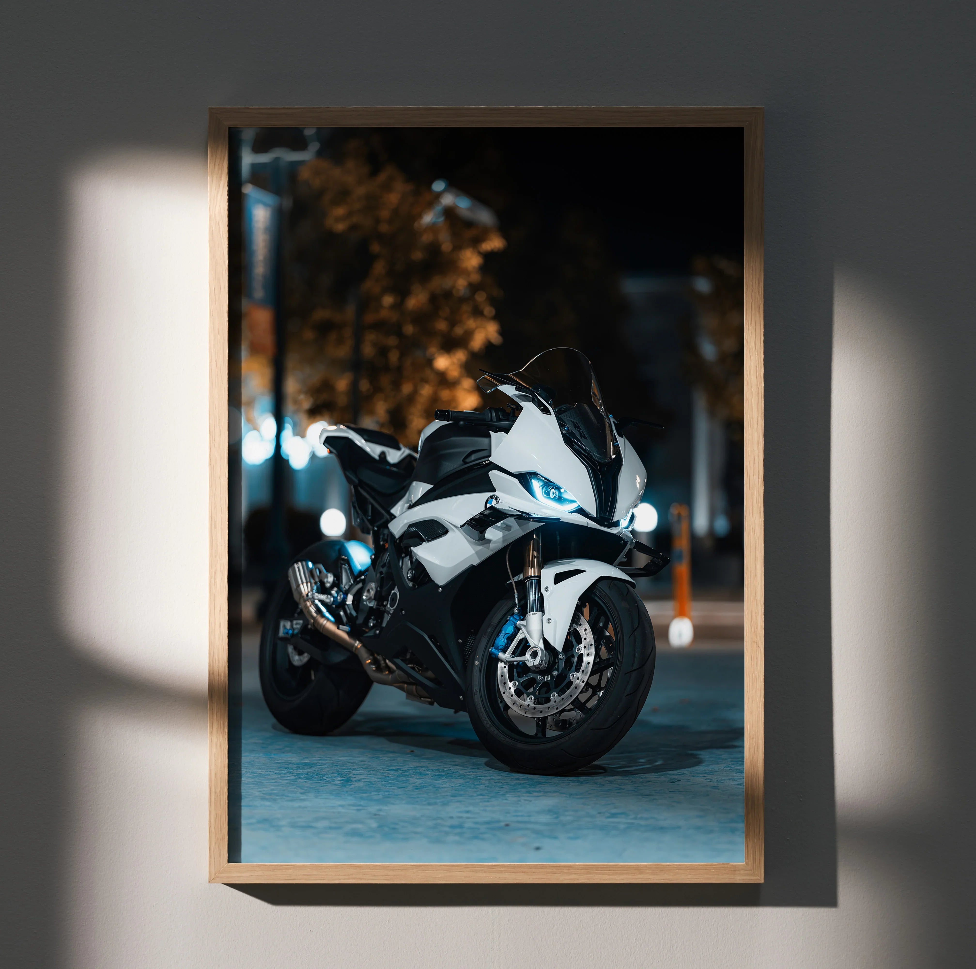BMW S1000RR motorcycle poster with sleek white and blue design, modern wall art in wooden frame.