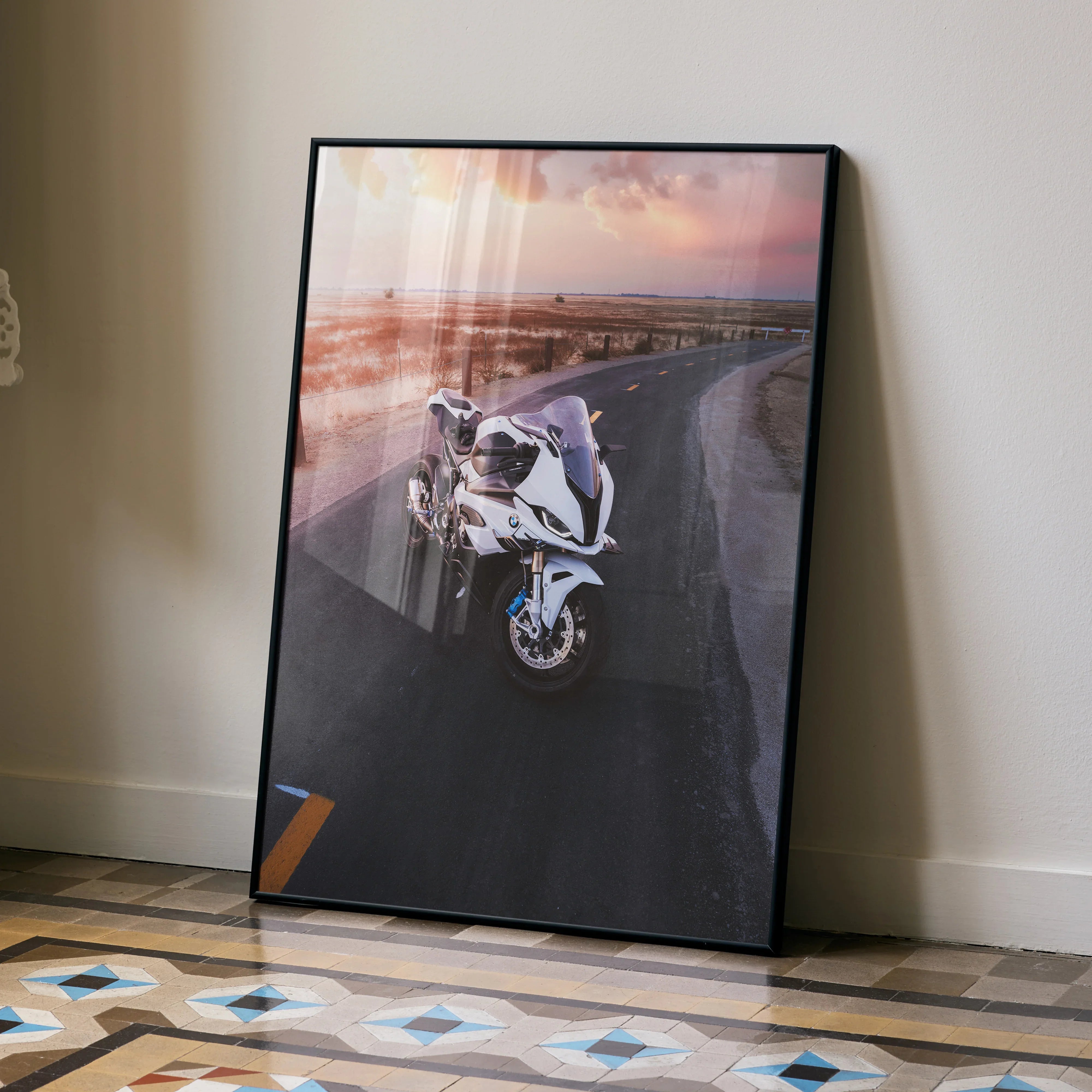 BMW S1000RR motorcycle wall art poster with sunset background in sleek black frame.