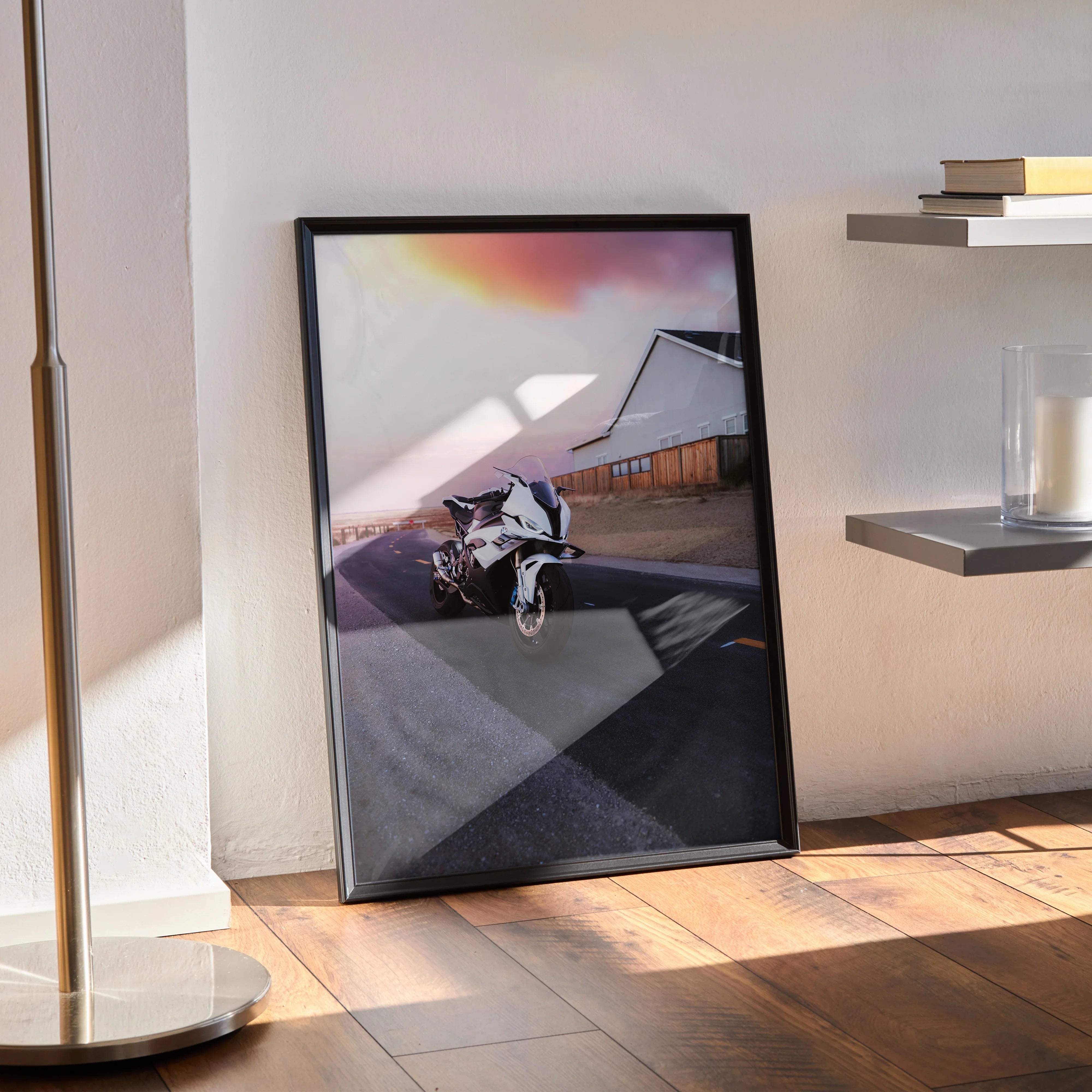 BMW S1000RR motorcycle poster leaning against wall with sunset sky, modern wall art in black frame.