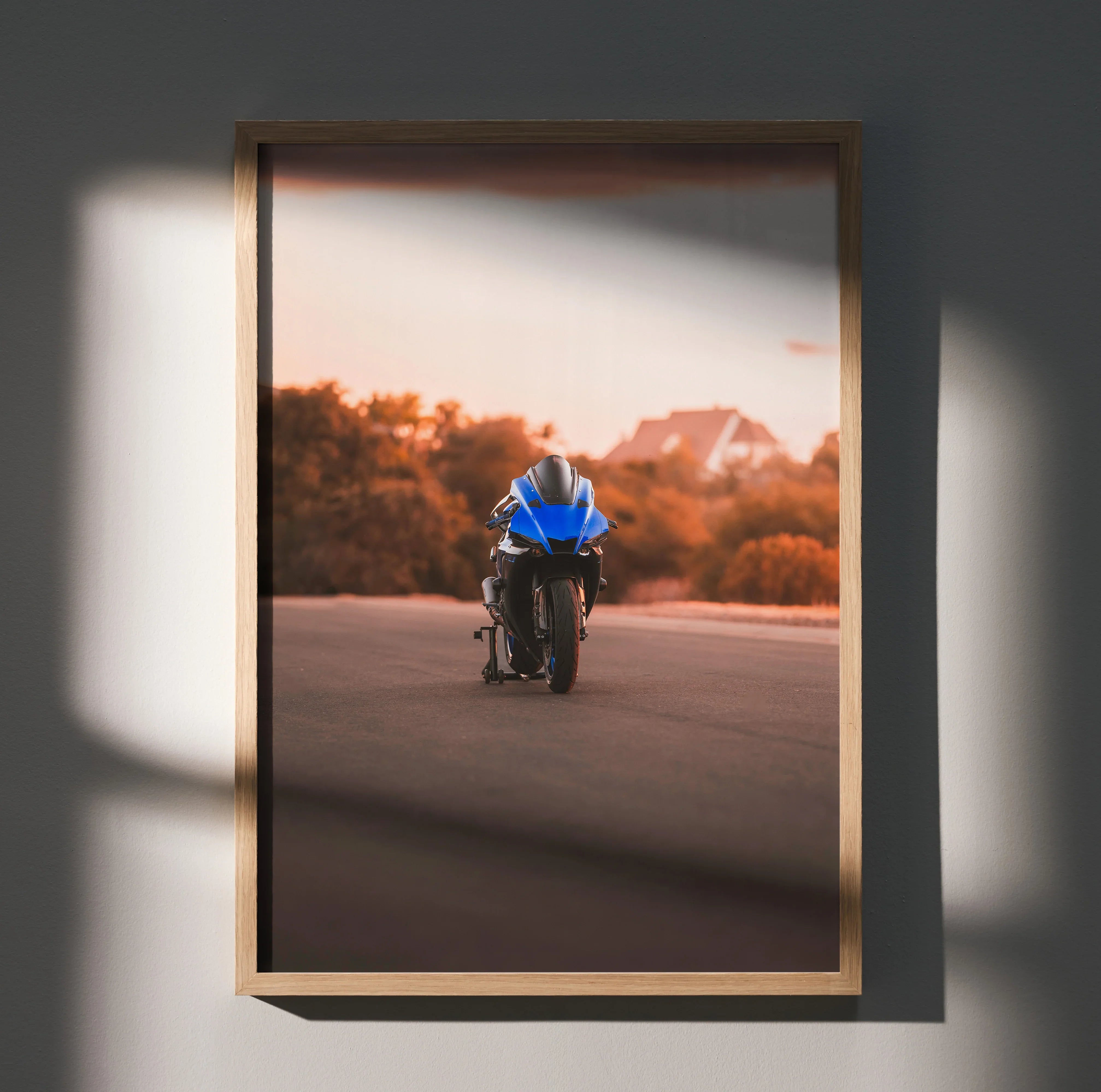 Yamaha R1 motorcycle poster with rider in blue gear on sunset road, framed wall art.