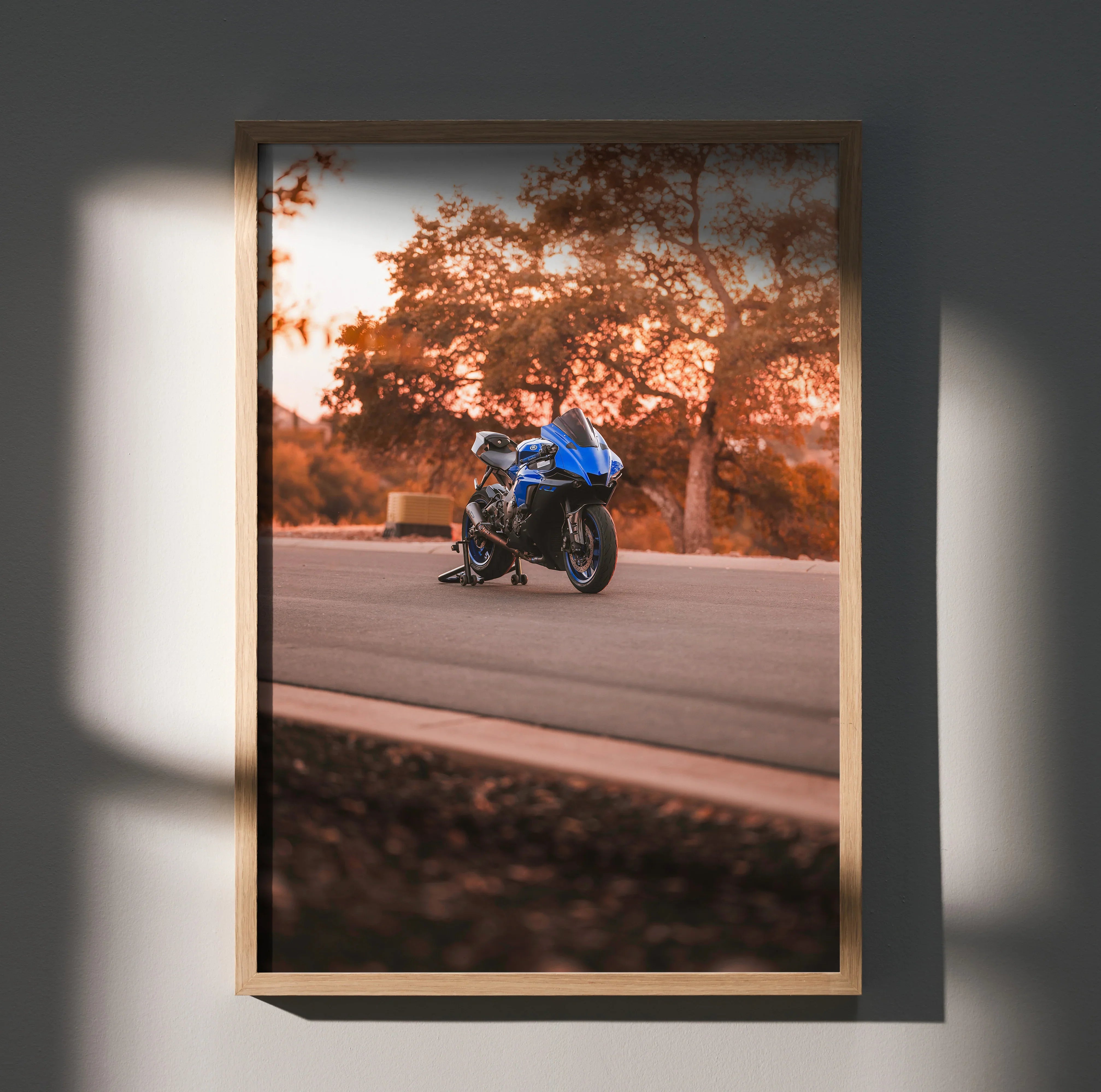 Yamaha R1 motorcycle on road in autumn setting poster wall art with warm tones.