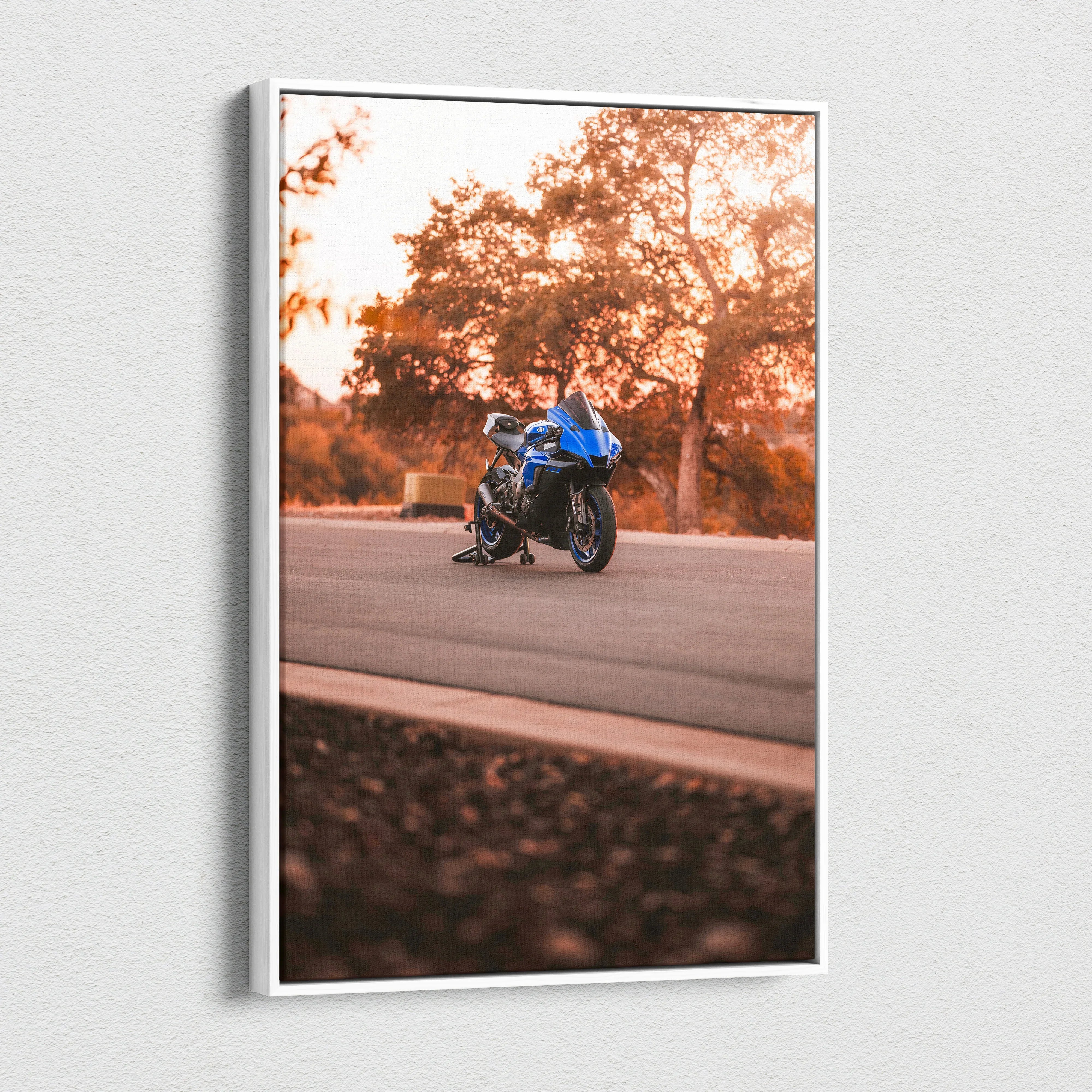 Yamaha R1 motorcycle on road at sunset canvas wall art with warm autumn tones.