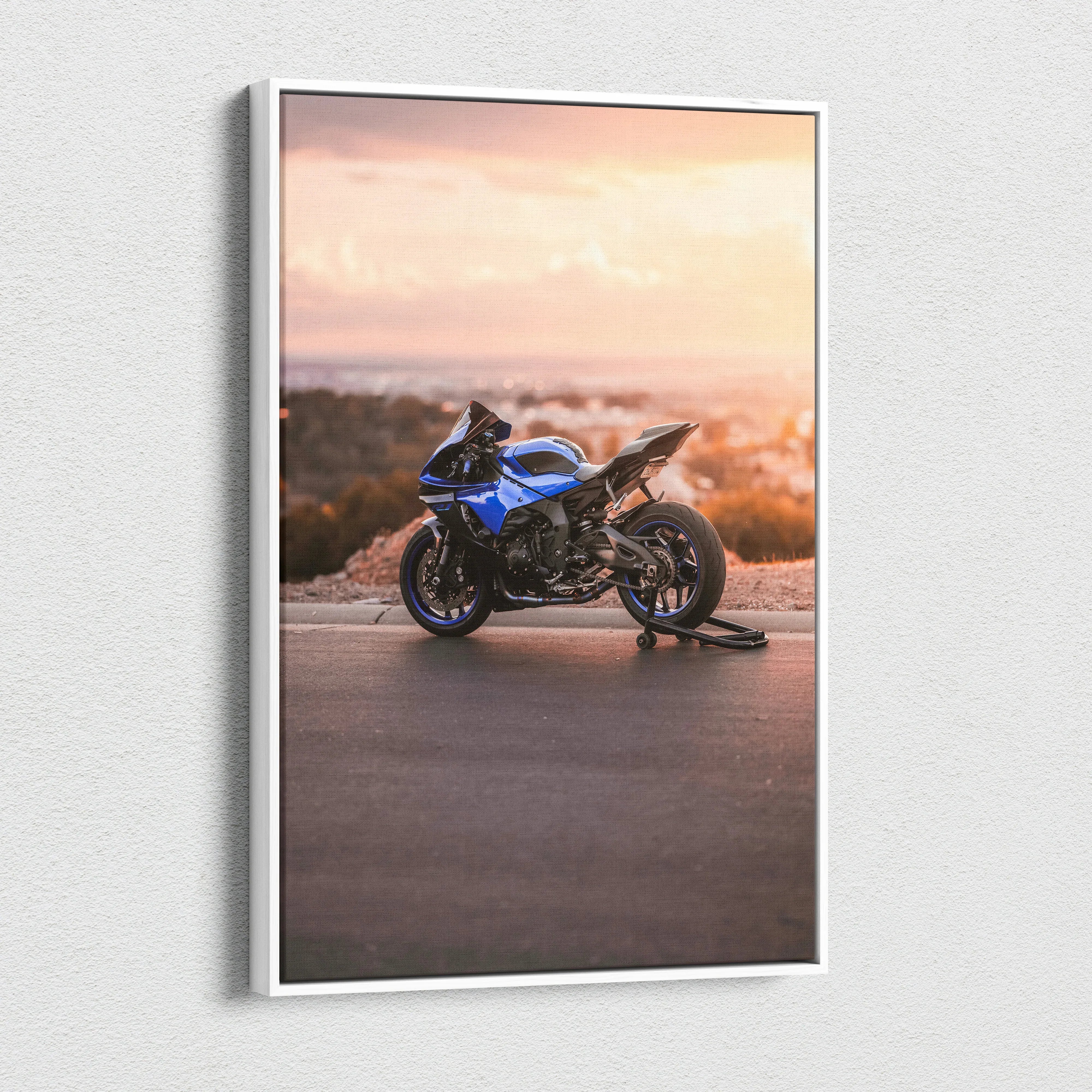 Yamaha R1 sport motorcycle against a sunset backdrop on vertical canvas wall art.