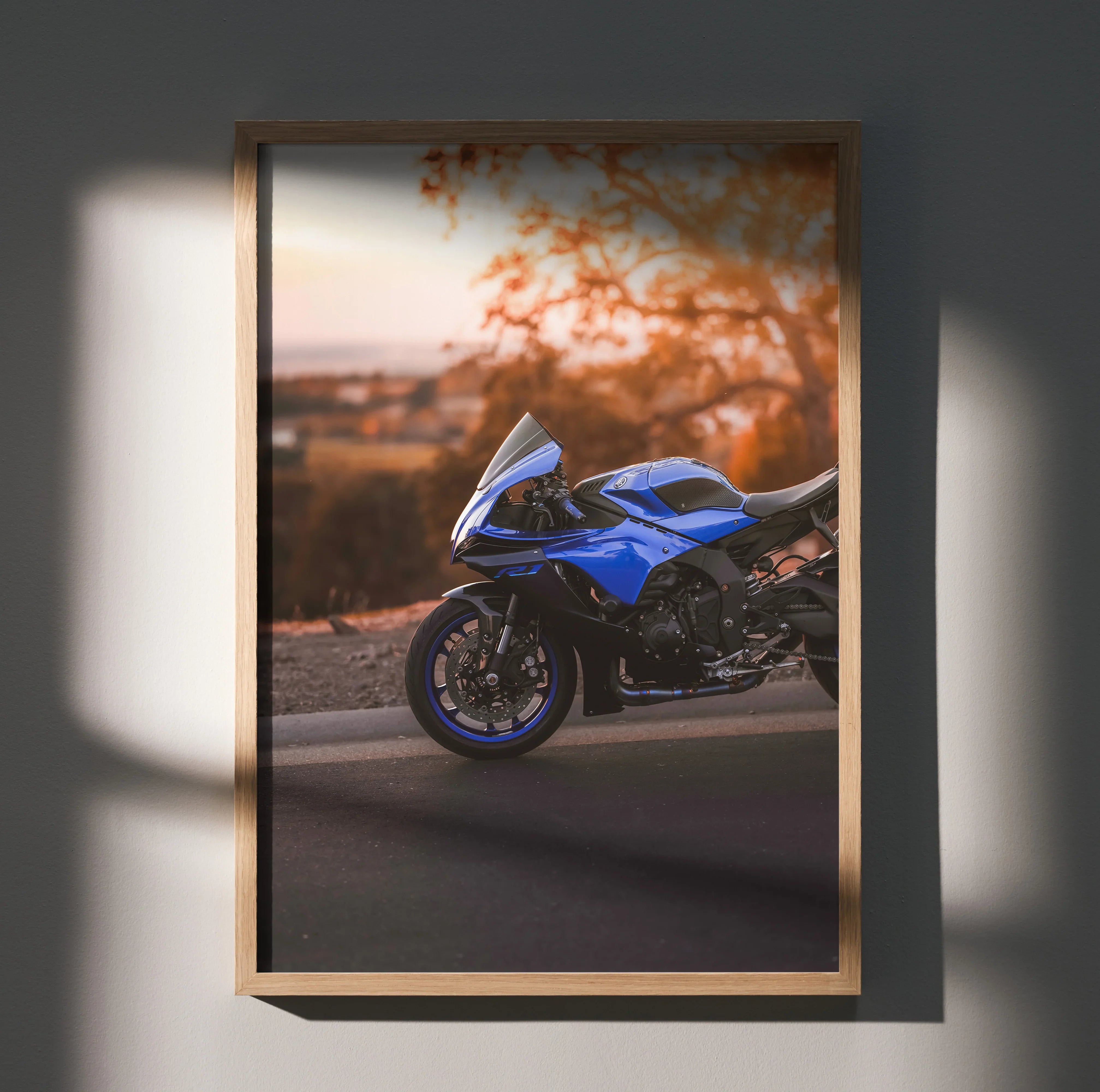 Yamaha R1 blue sport motorcycle poster with autumn background wall art in wooden frame.