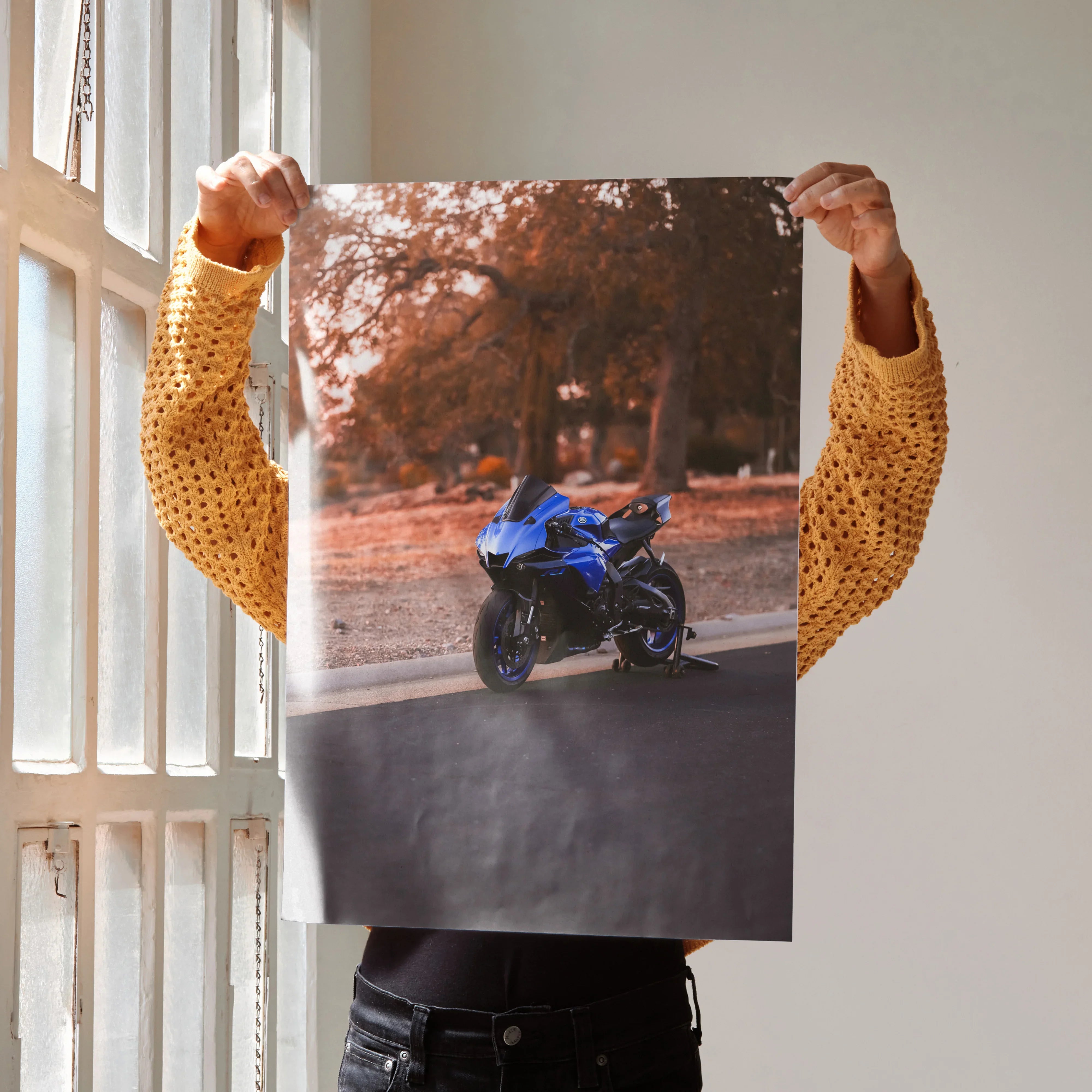 Yamaha R1 motorcycle poster in blue on satin wall art with autumn trees background.