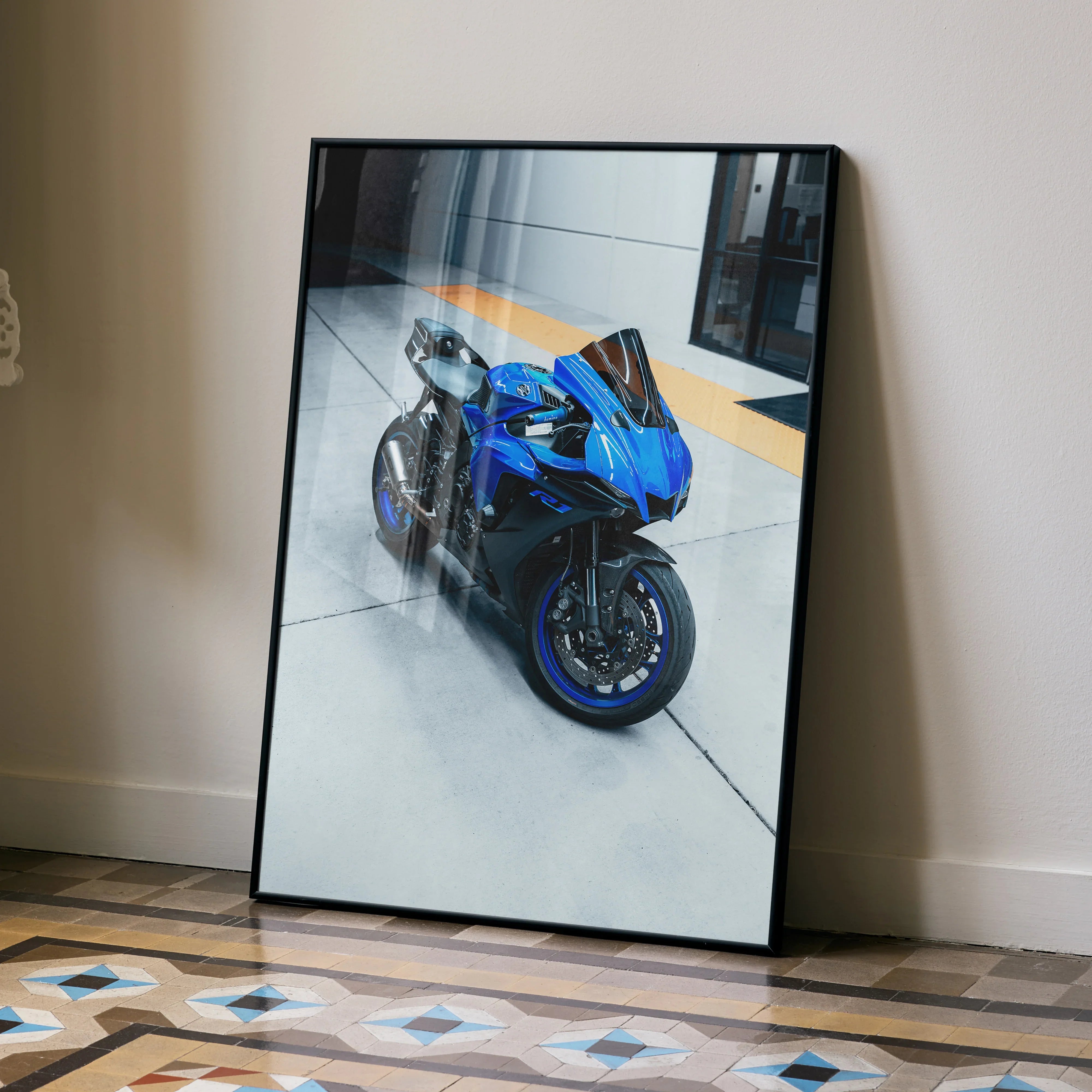 Yamaha R1 blue motorcycle poster leaning against beige wall, modern wall art.