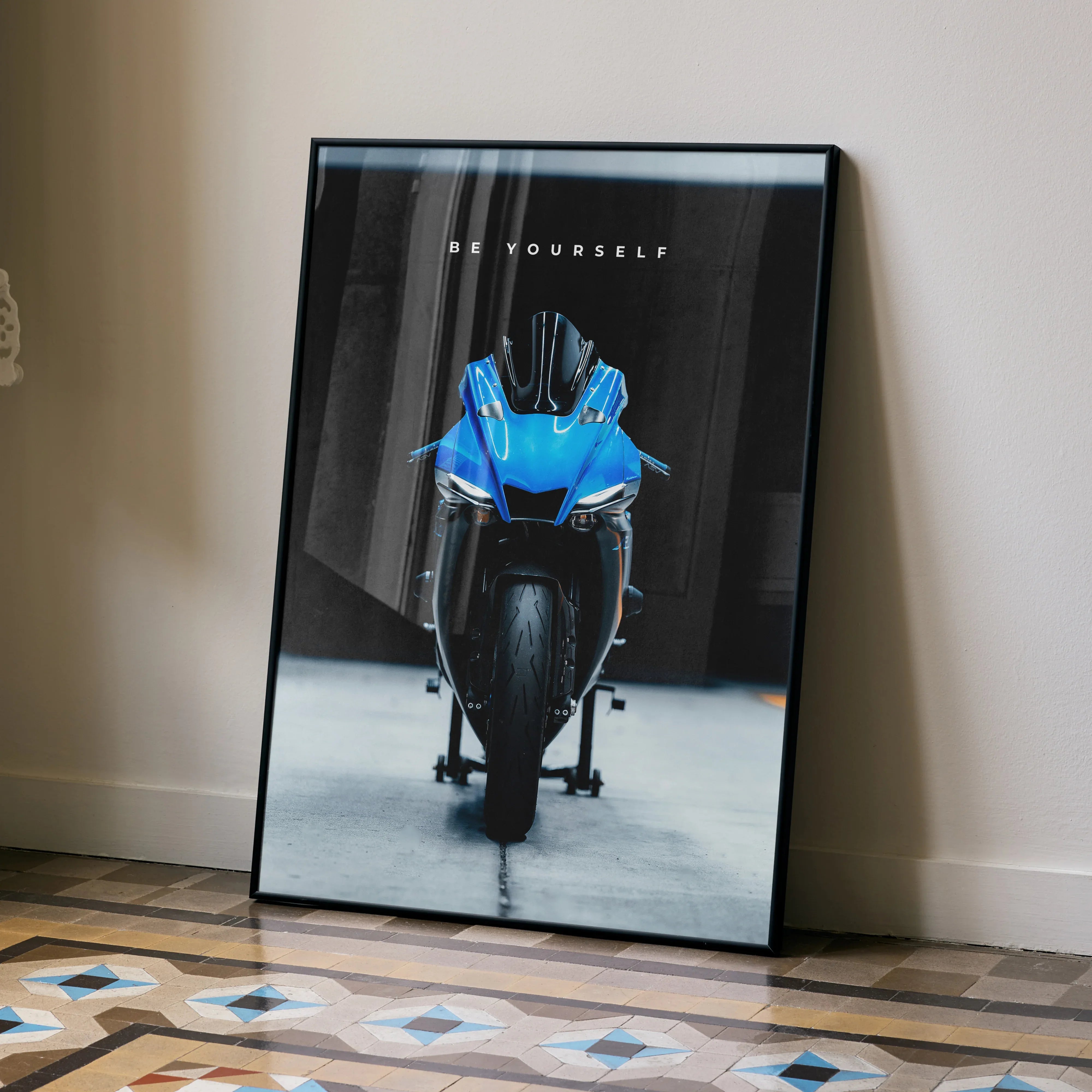 Motivational wall art poster featuring a front view of a blue Yamaha R1 motorcycle with inspiring text on black background.