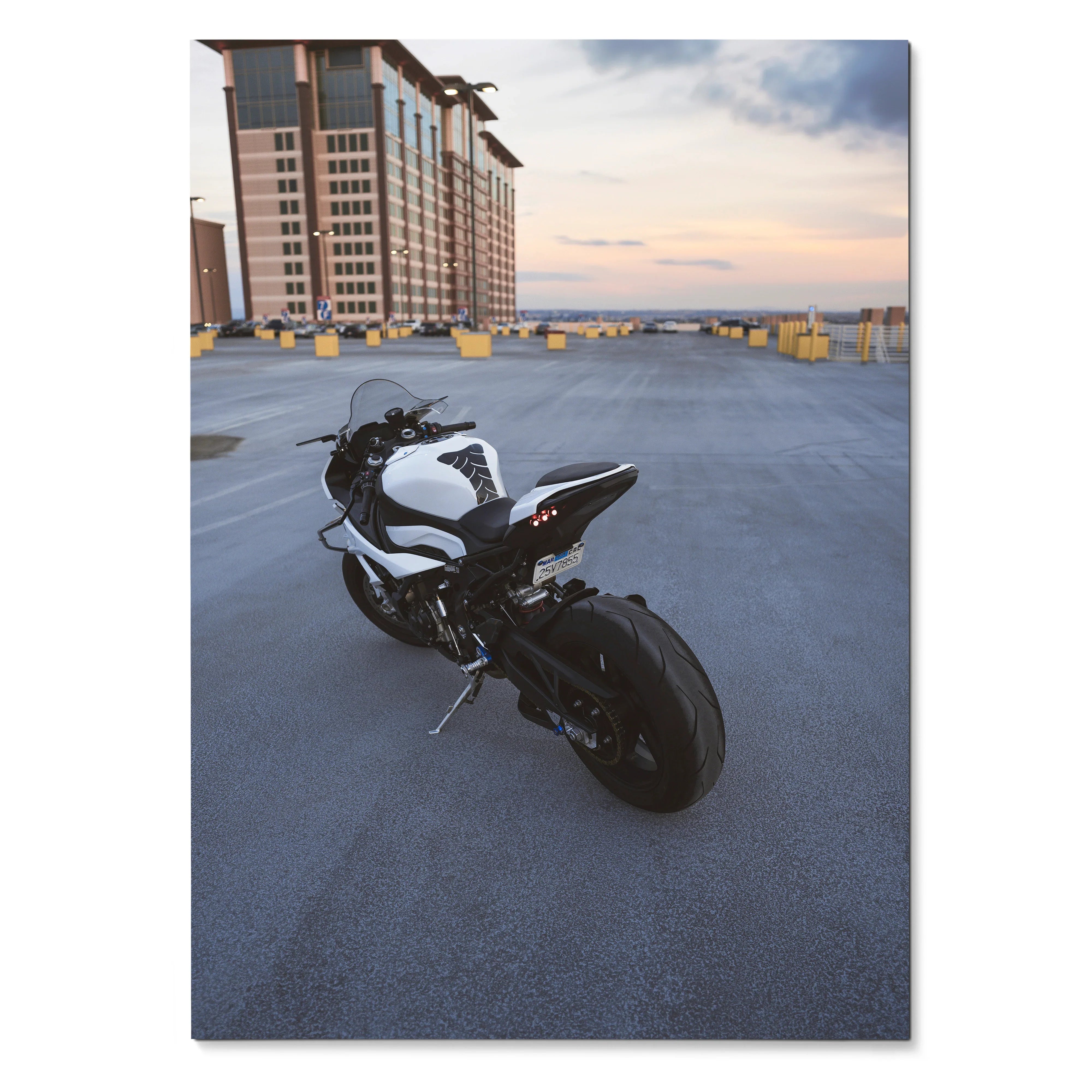 BMW S1000RR motorcycle parked on rooftop at sunset poster wall art in satin finish.