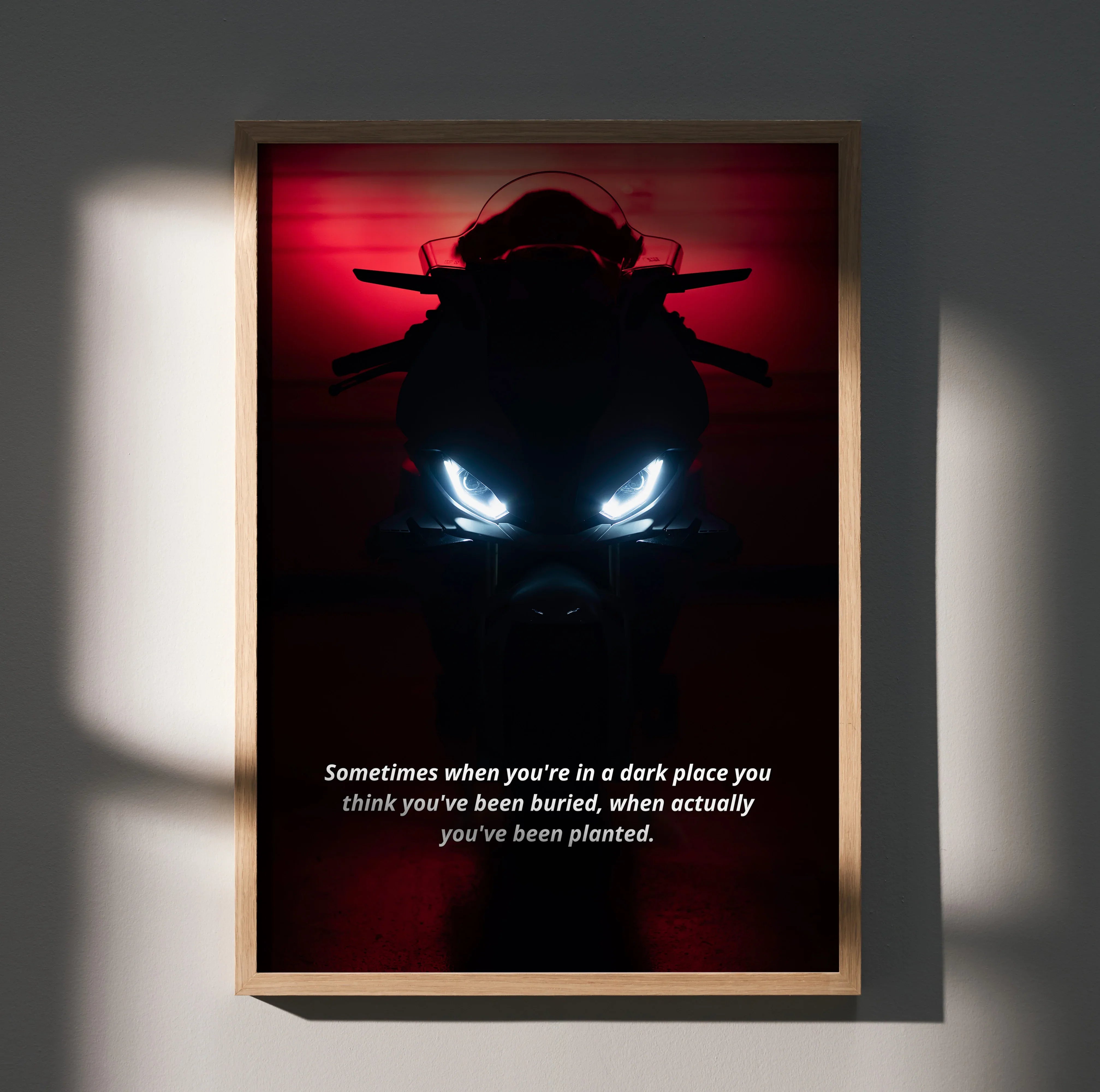 BMW S1000RR poster with glowing headlights and motivational text, dark red background wall art.