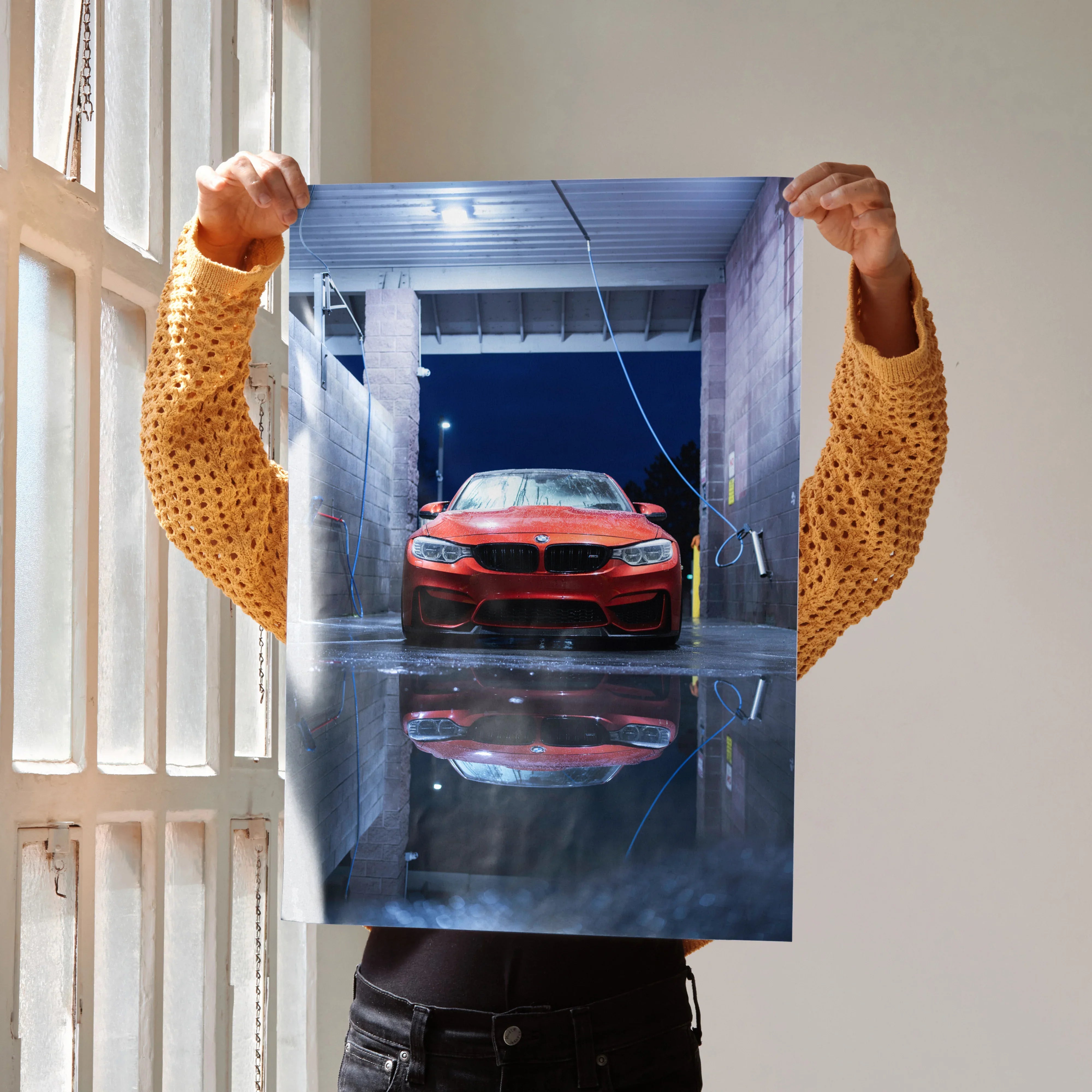 BMW F80 M3 in red with glossy reflection poster wall art in industrial garage setting.
