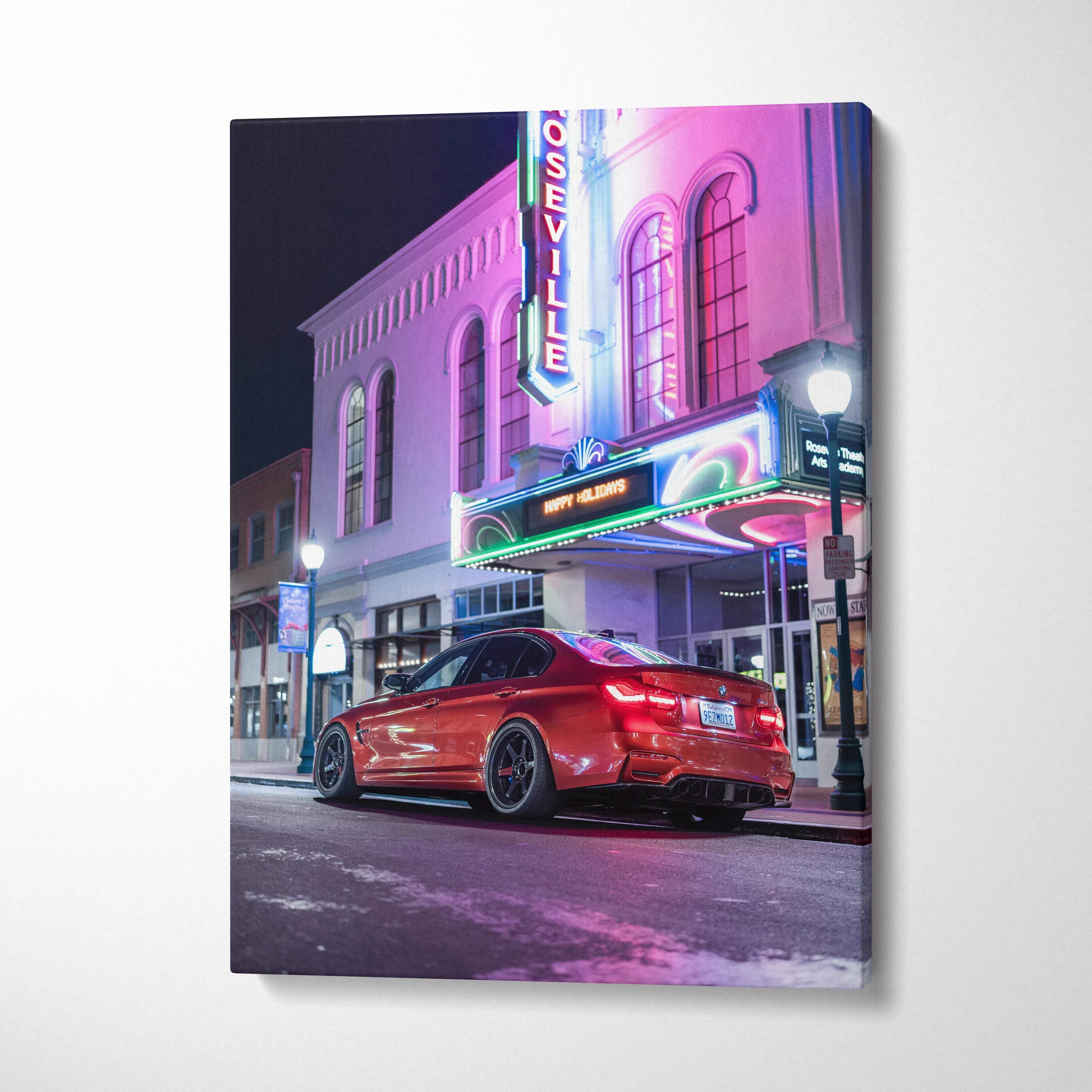 Vertical canvas wall art featuring a red BMW F80 M3 parked under neon lights on a city street at night.
