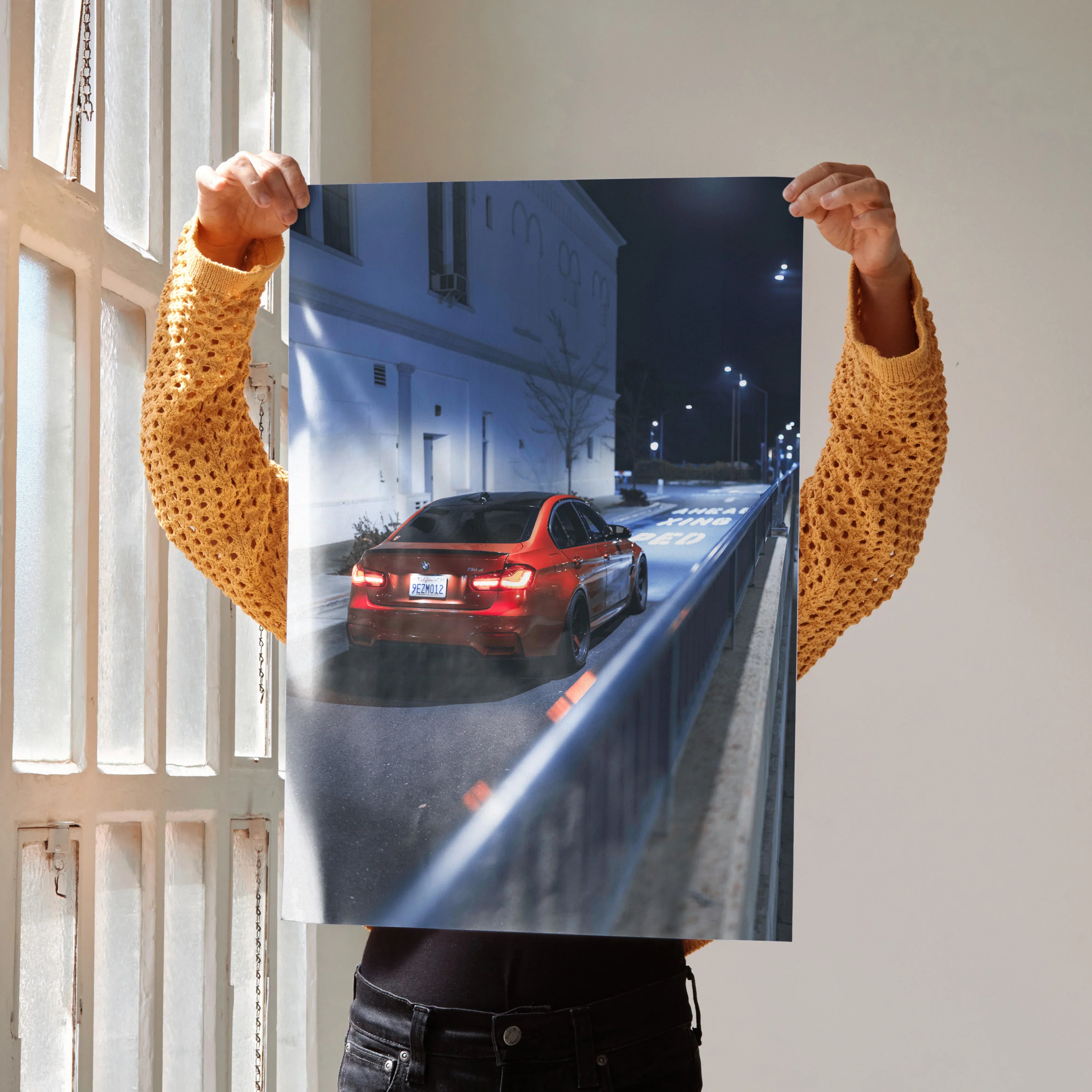 BMW F80 M3 rear view at night poster with red taillights, urban street wall art.