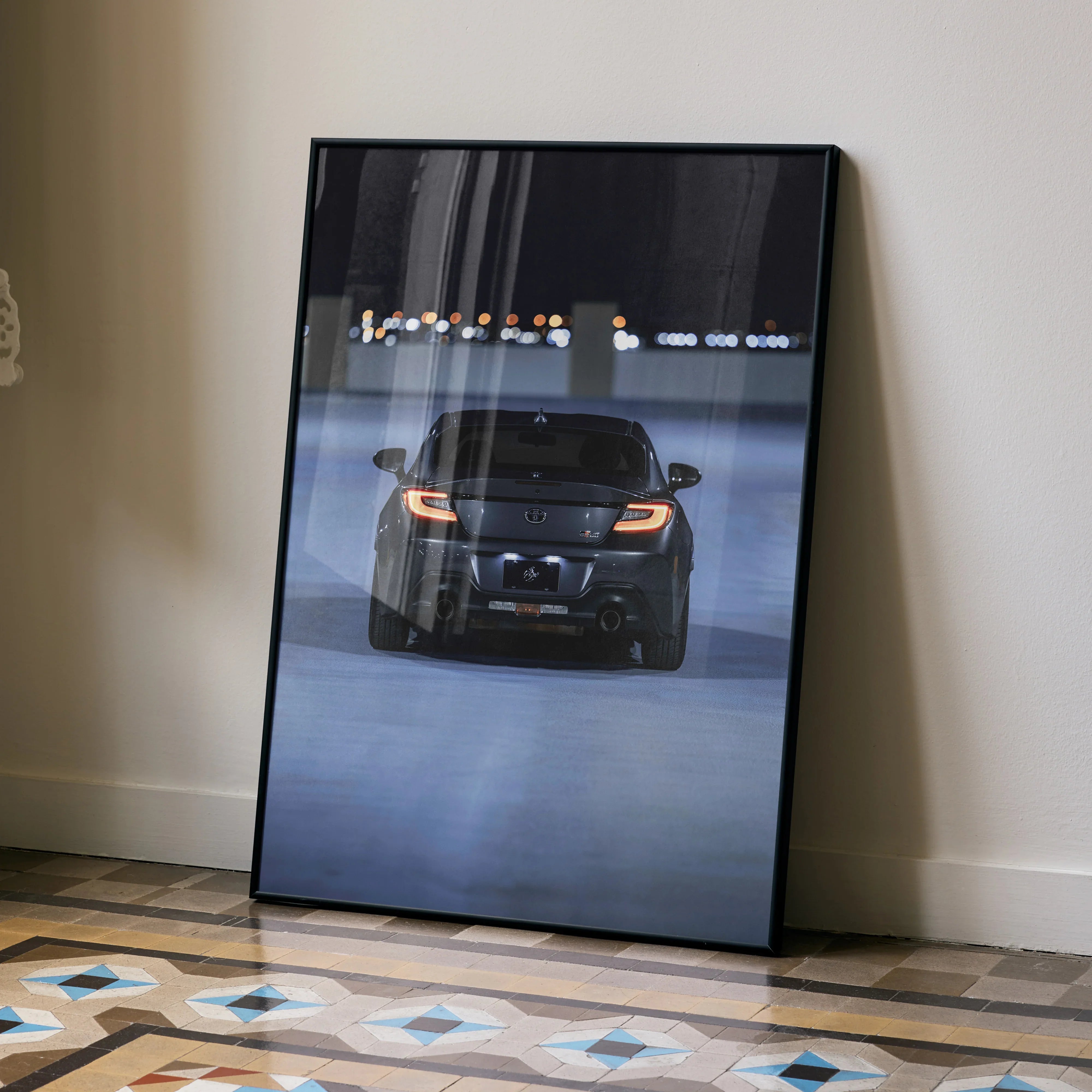 Toyota GR86 sports car night scene poster with sleek black and blue tones, automotive wall art.