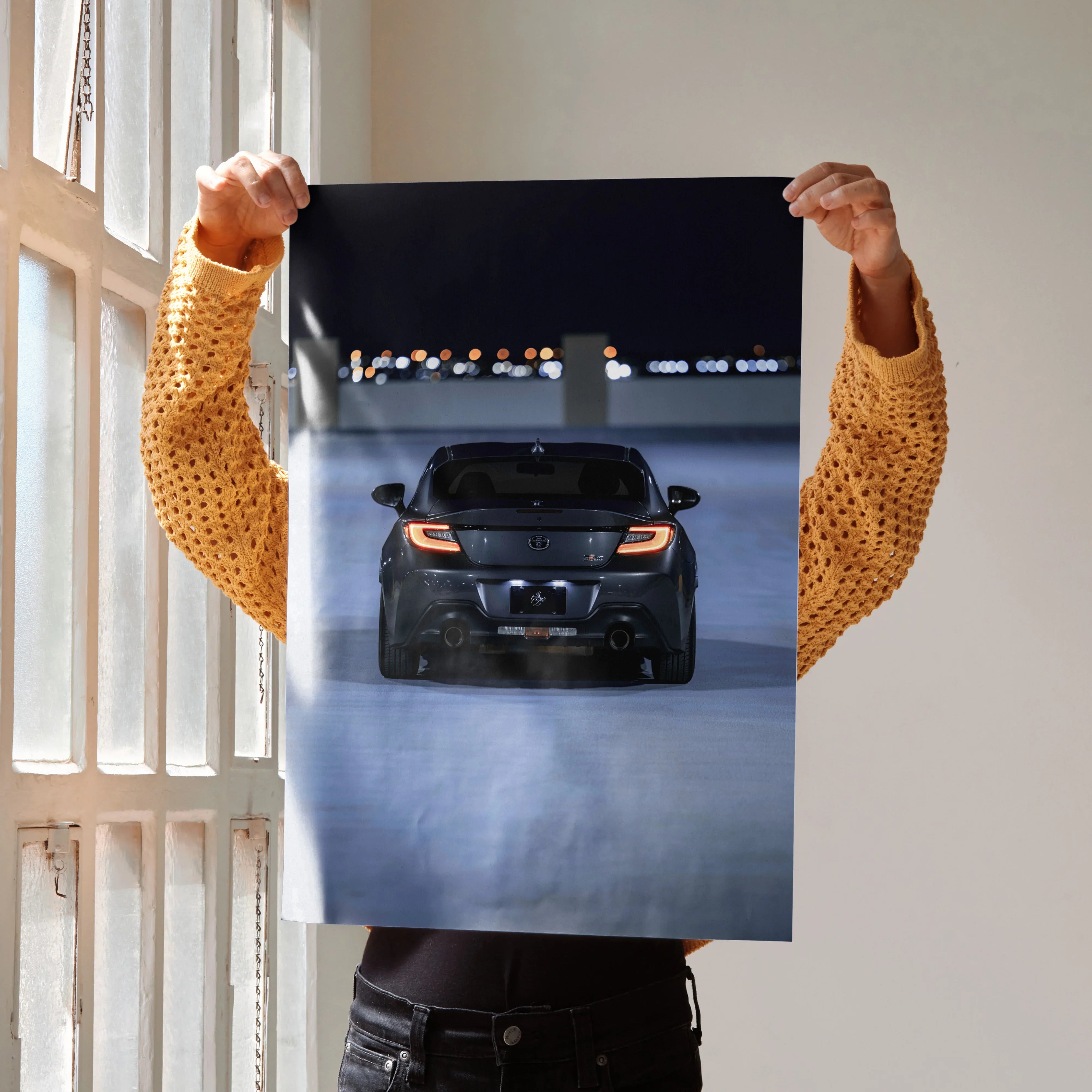 Toyota GR86 rear view at night poster showcasing sleek car taillights, automotive wall art.