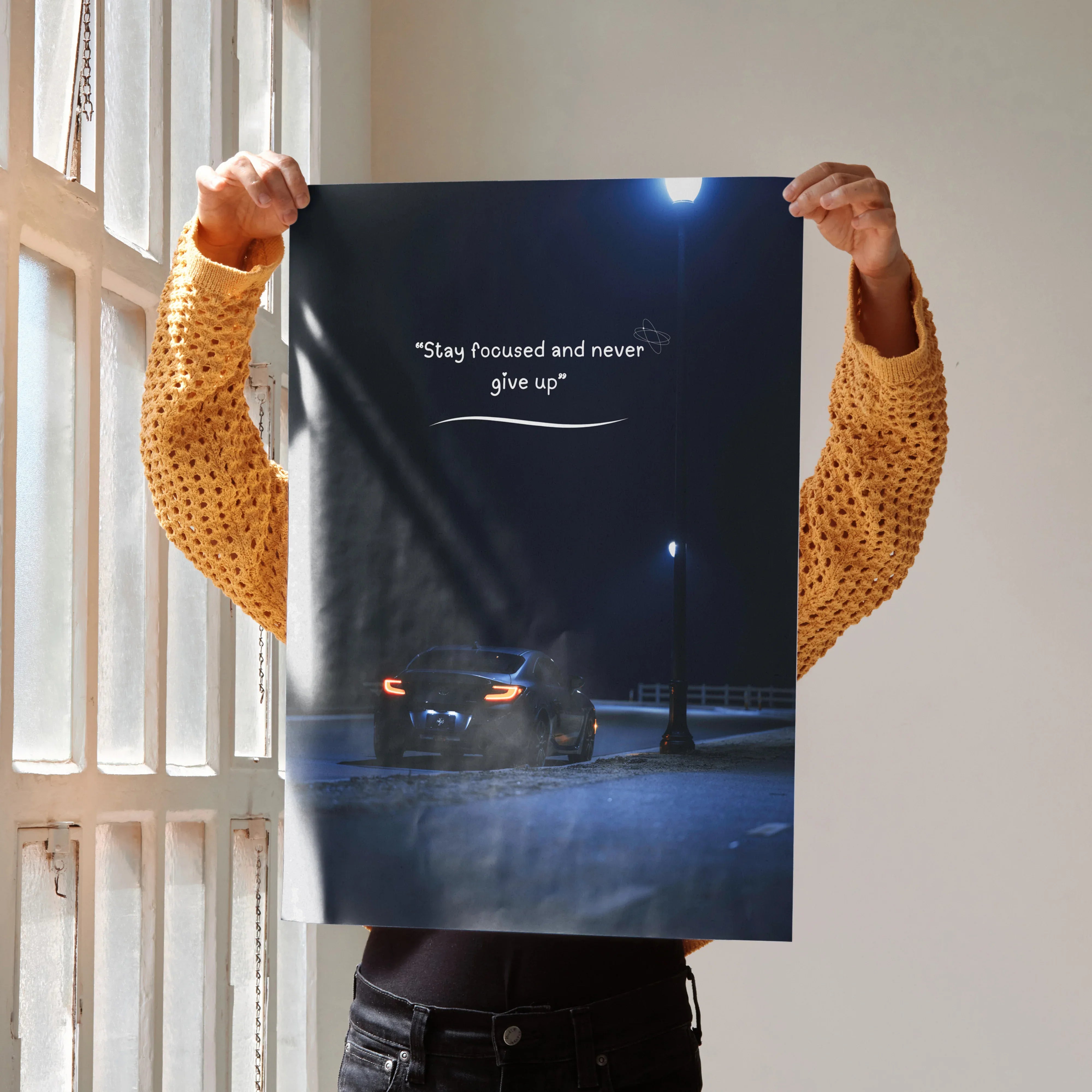 Motivational poster wall art featuring Toyota GR86 in a dark street setting with inspiring text "Stay focused and never give .