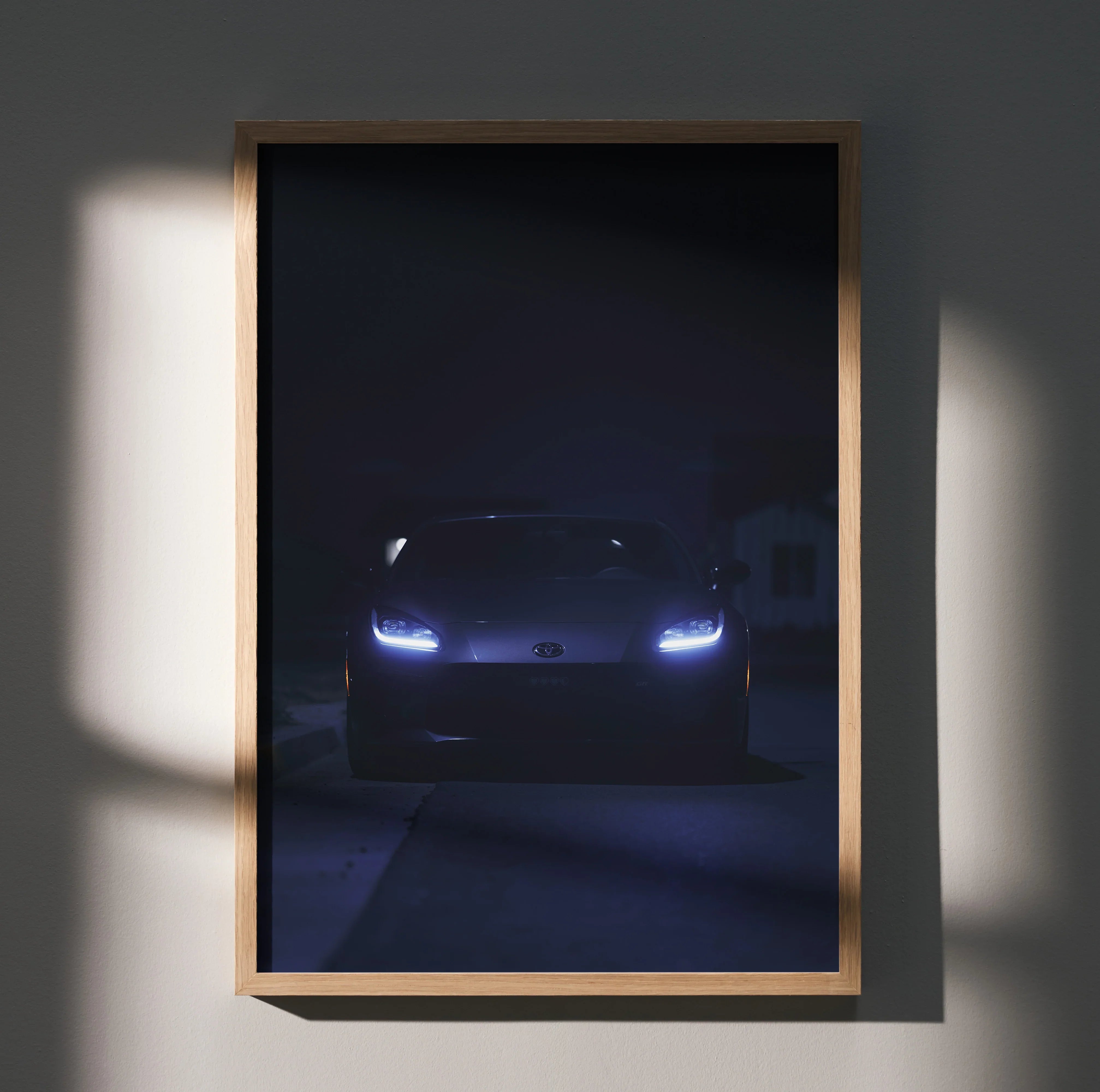 GR86 automotive art poster with dark, moody lighting and glowing headlights wall art.