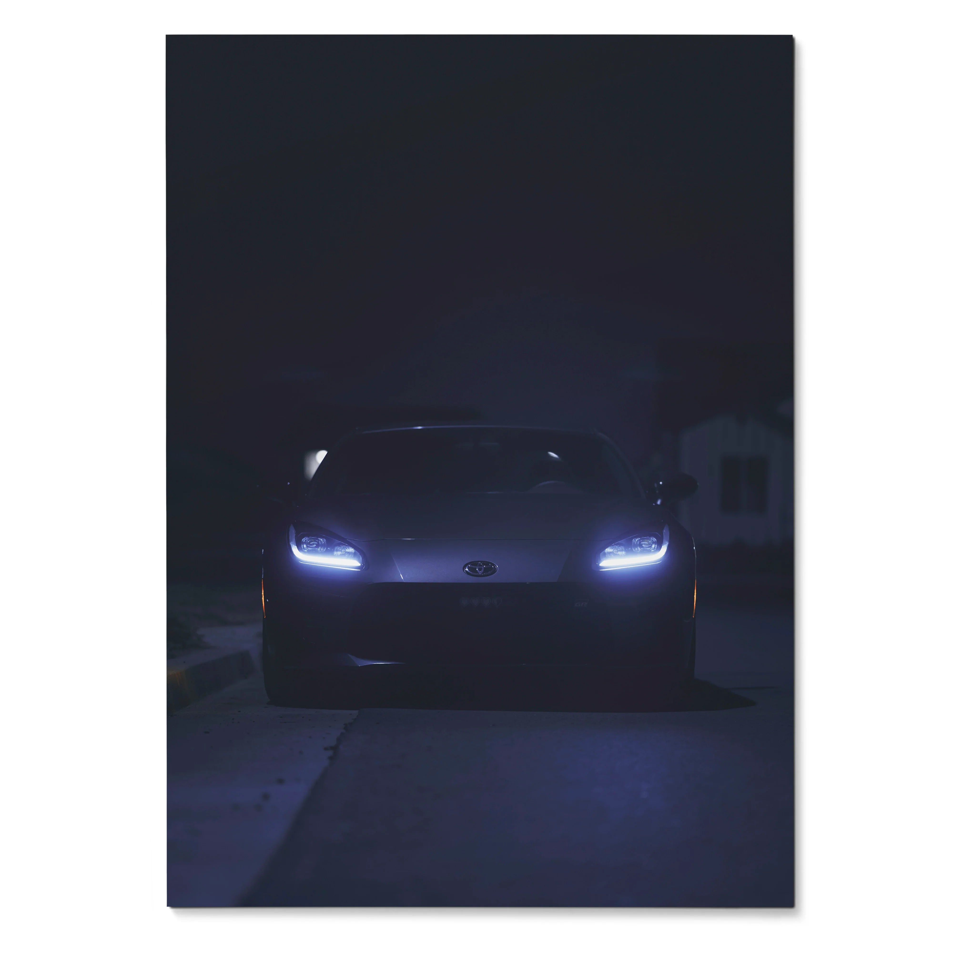 Dark automotive poster featuring Toyota GR86 front view with glowing headlights, wall art design.