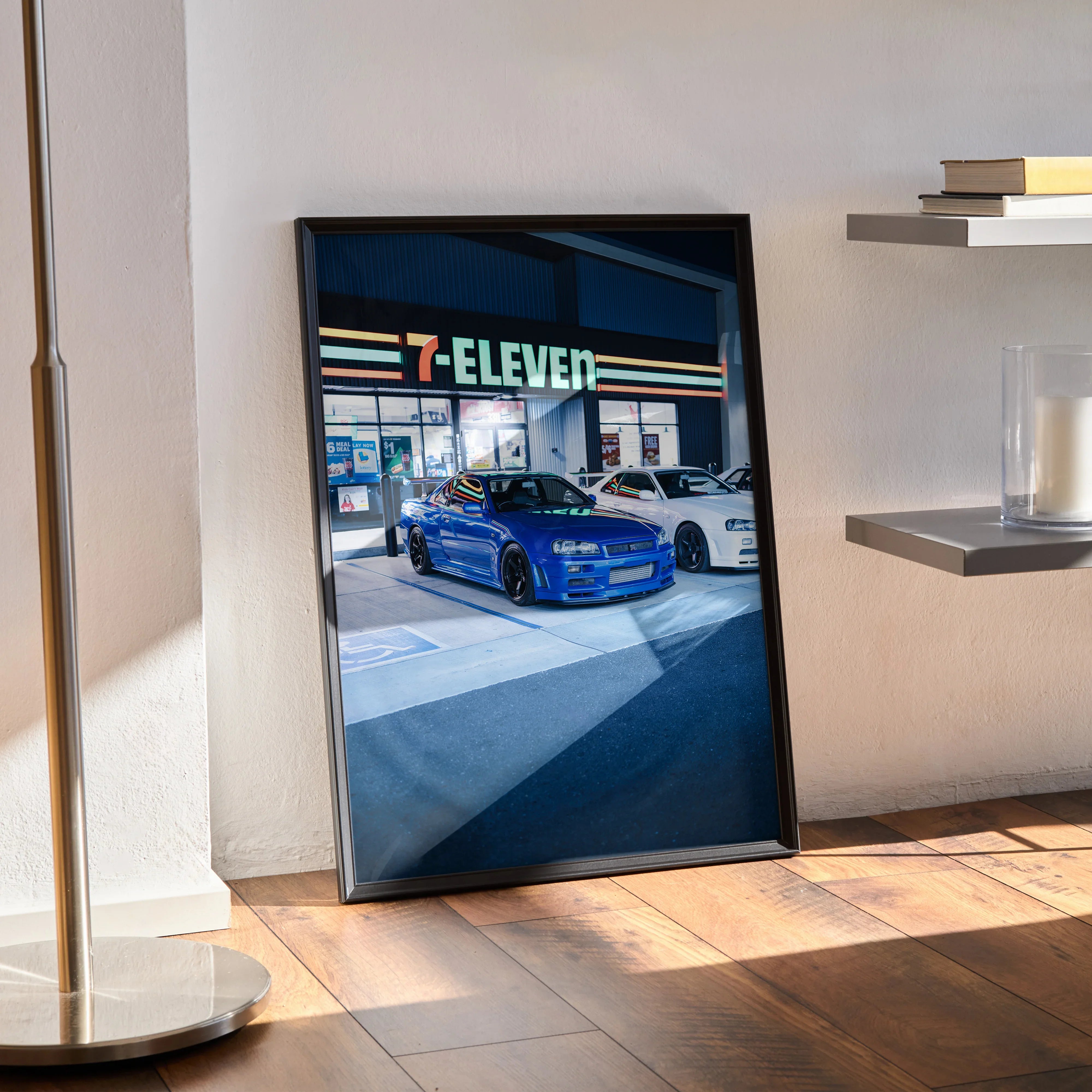 Nissan GTR R34 Skyline poster wall art with blue car in front of 7-Eleven at night.