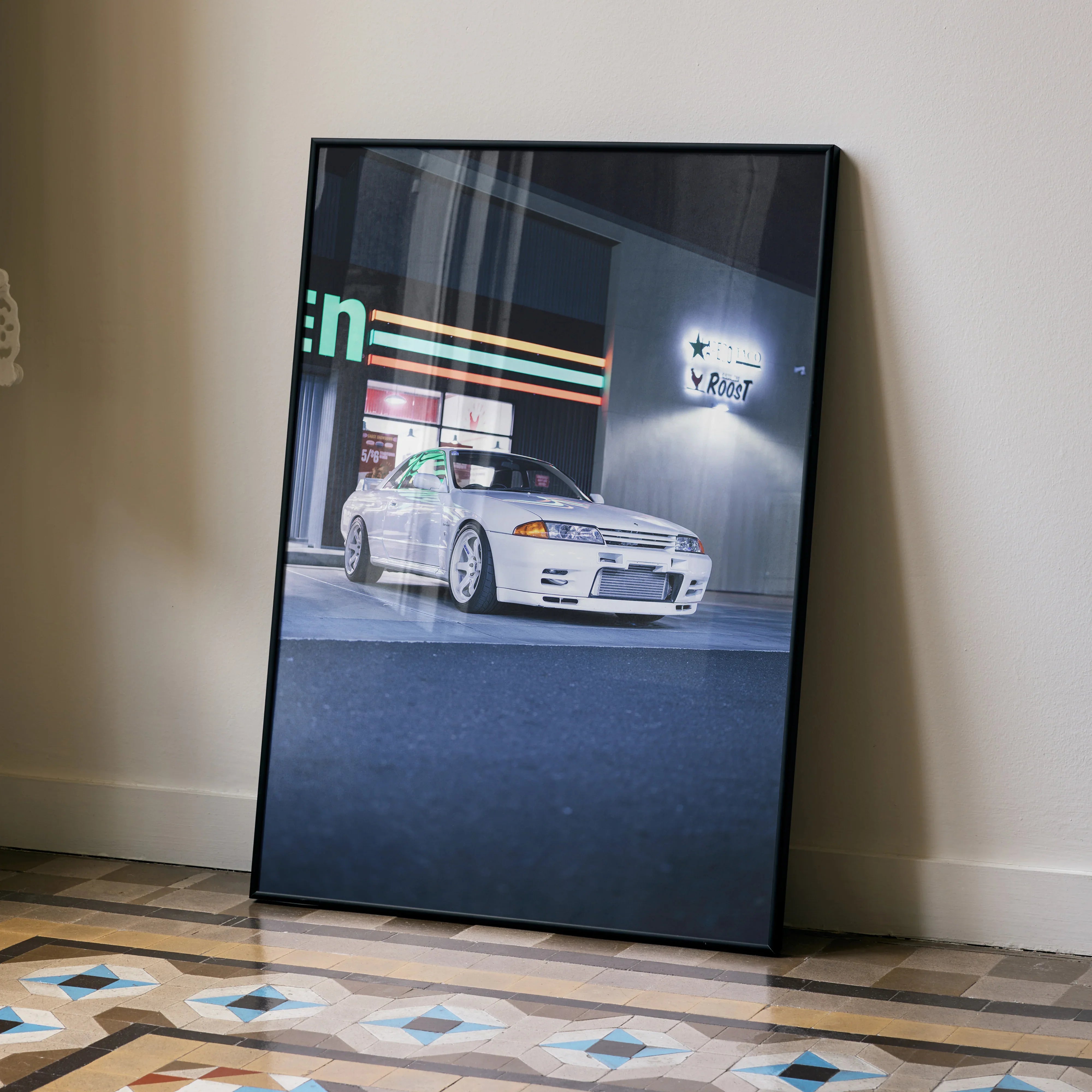 Nissan GTR R32 Skyline poster with white car parked under neon lights, automotive wall art.