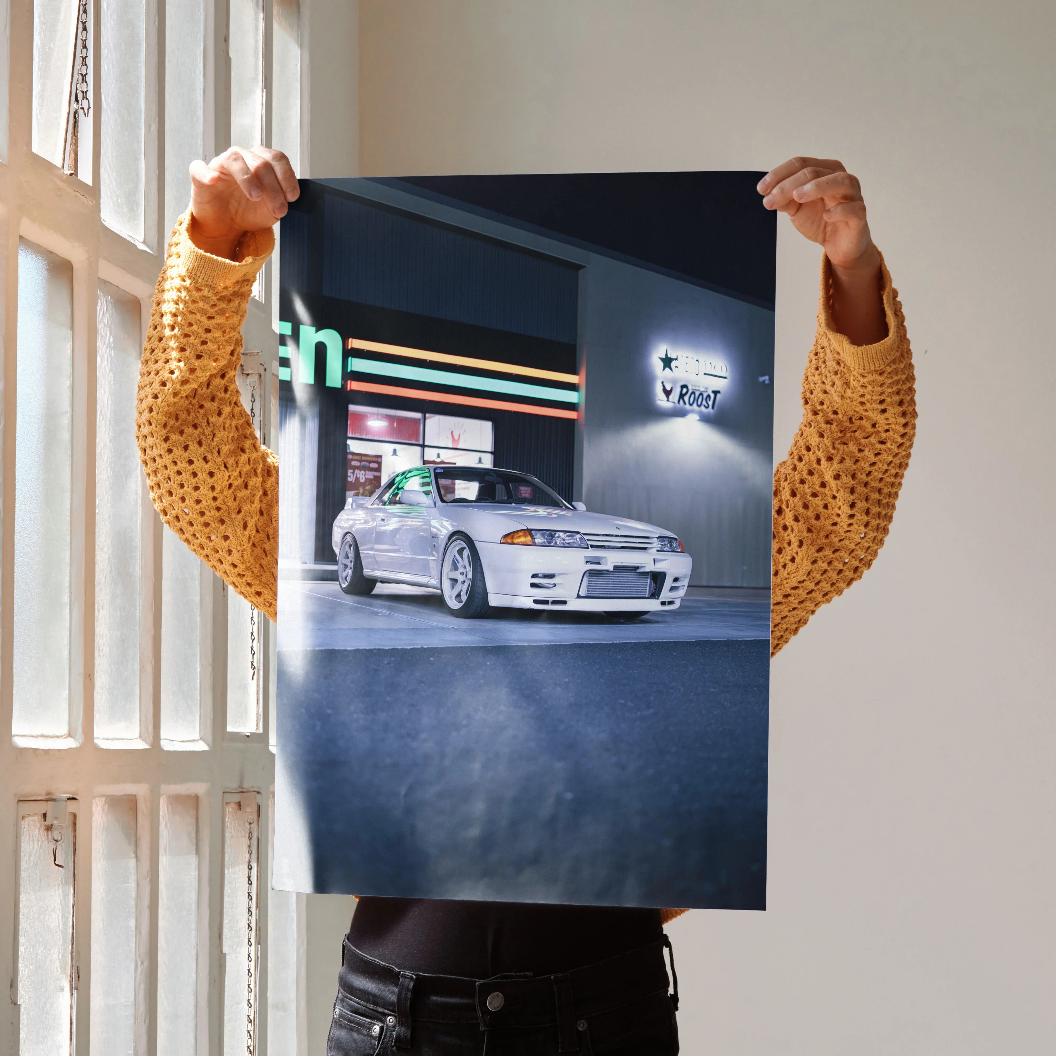 Nissan GTR R32 Skyline poster showing white car in front of a vintage gas station at night wall art.