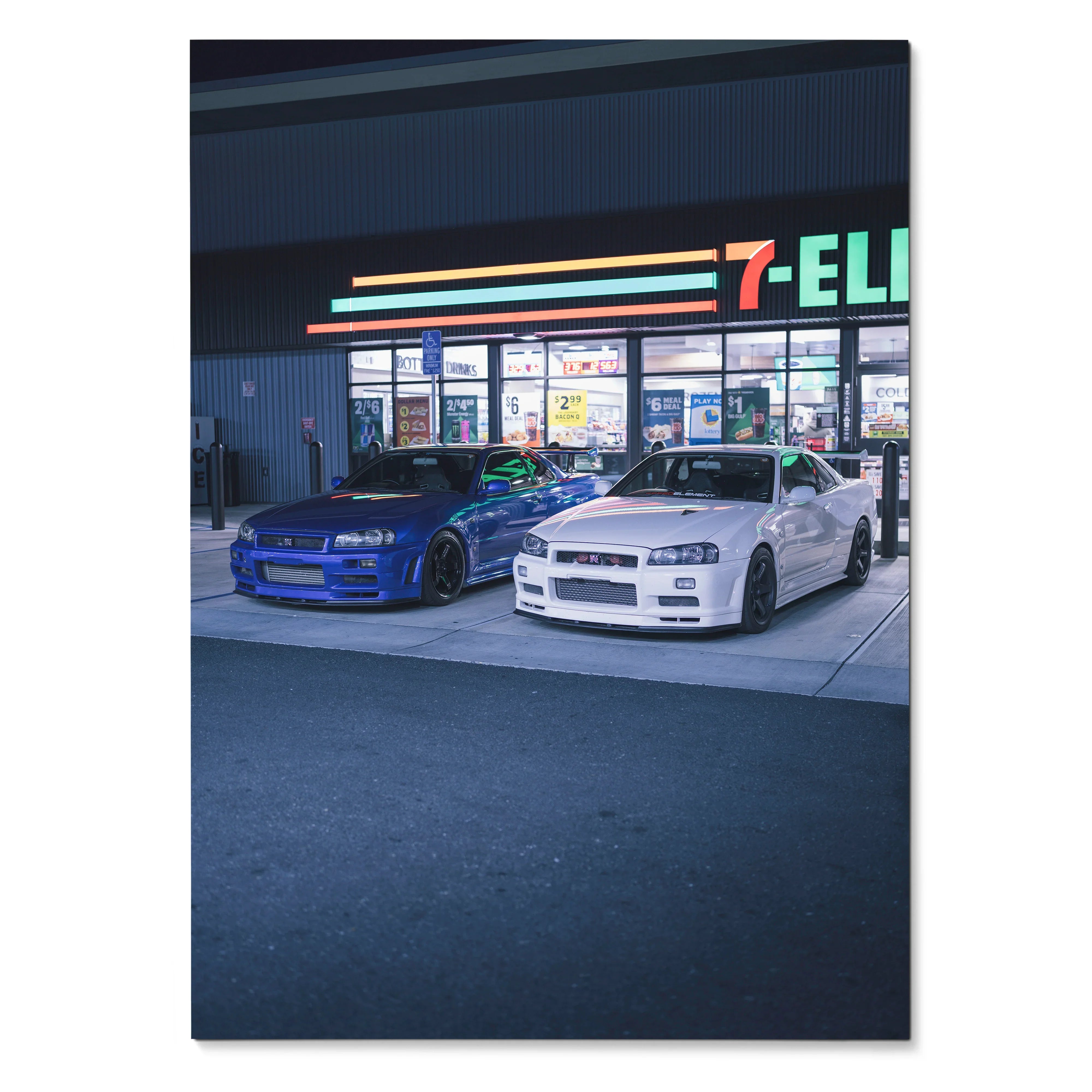 Nissan R34 GTR in blue and white parked at night outside 7-Eleven, poster wall art.