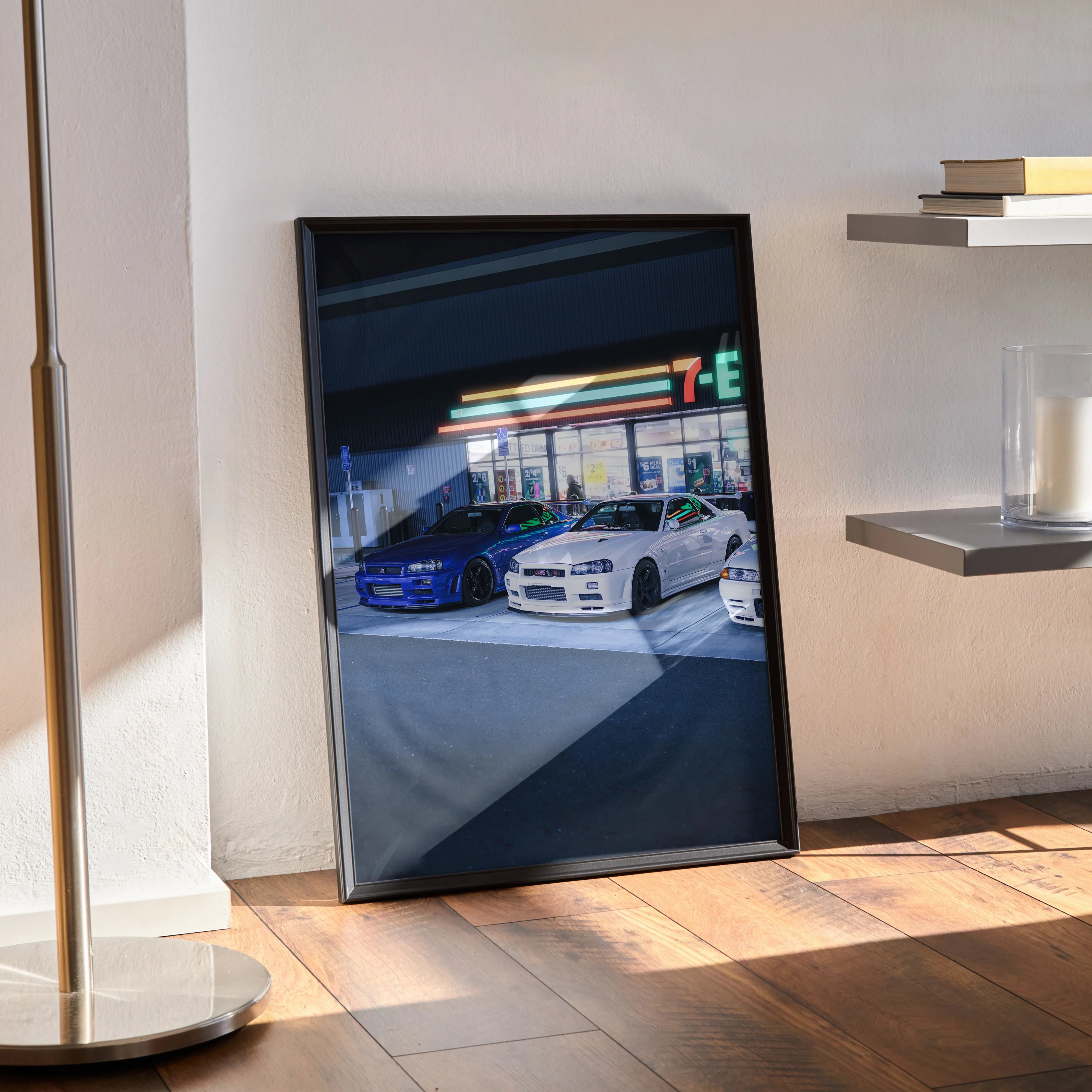 Nissan GTR R34 Skyline poster with blue and white cars parked under neon lights, framed wall art.