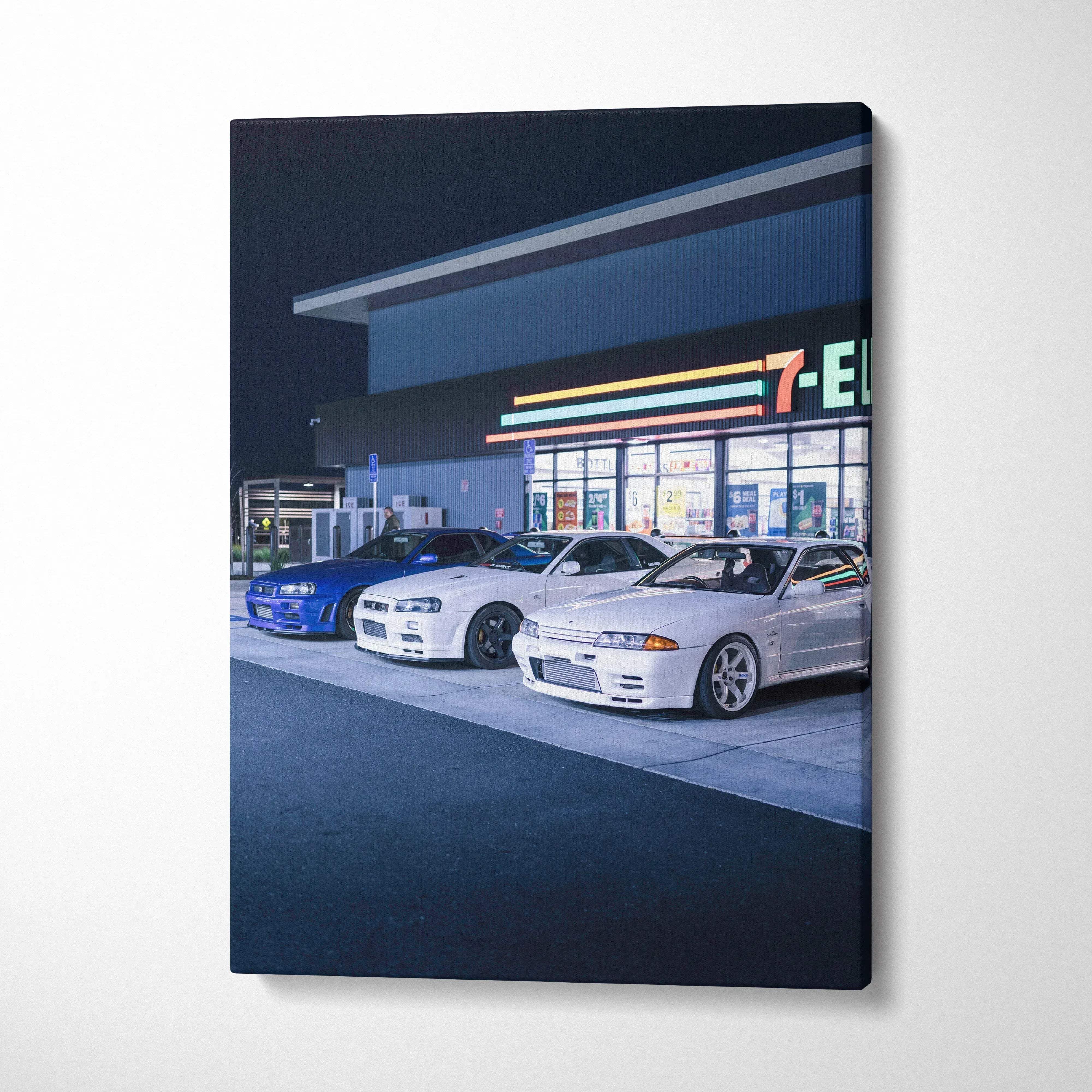 Vertical canvas art featuring Nissan GTR R34 Skyline cars parked at a gas station at night, modern wall art.