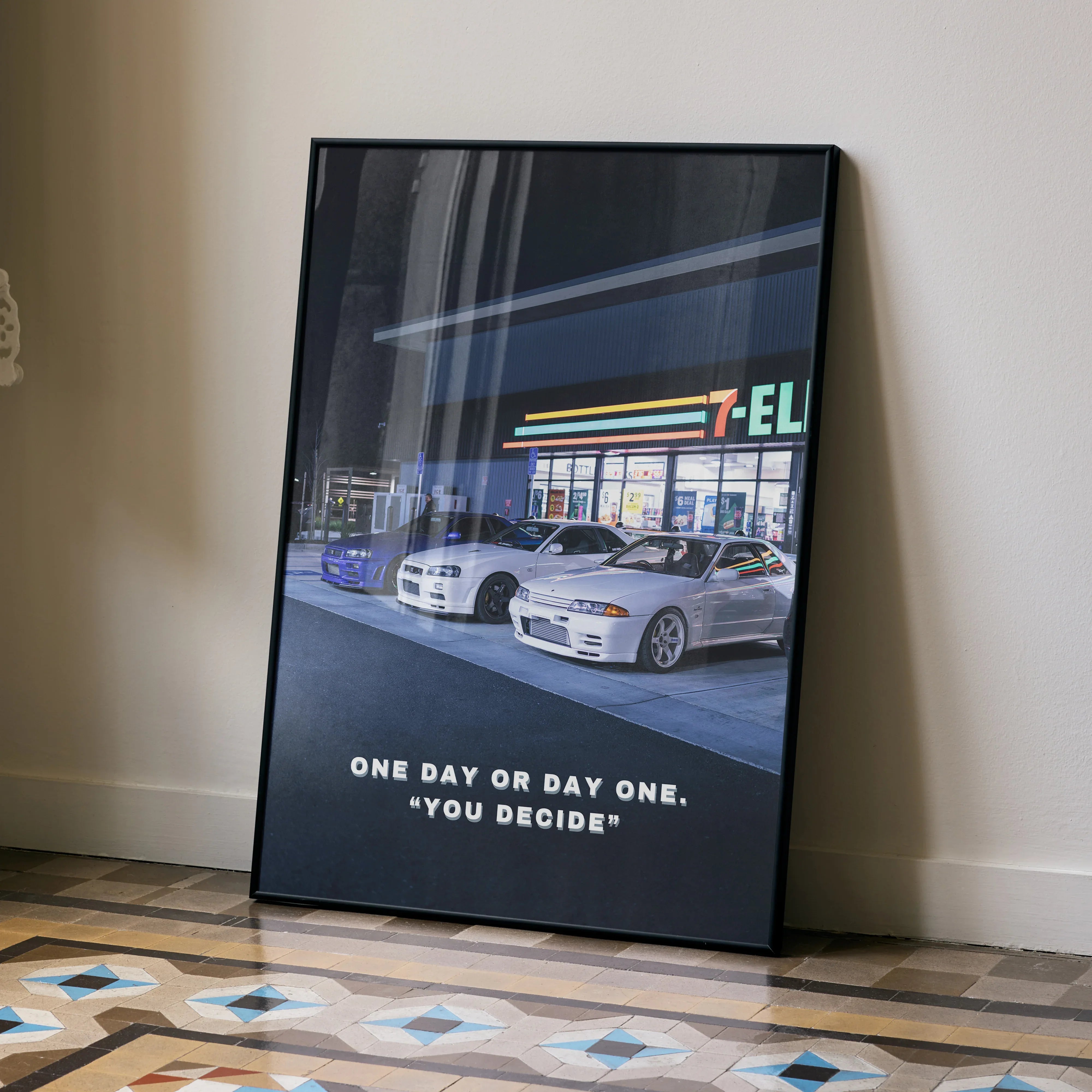 Motivational Nissan GT-R R34 Skyline poster wall art with cars at gas station and inspirational quote.