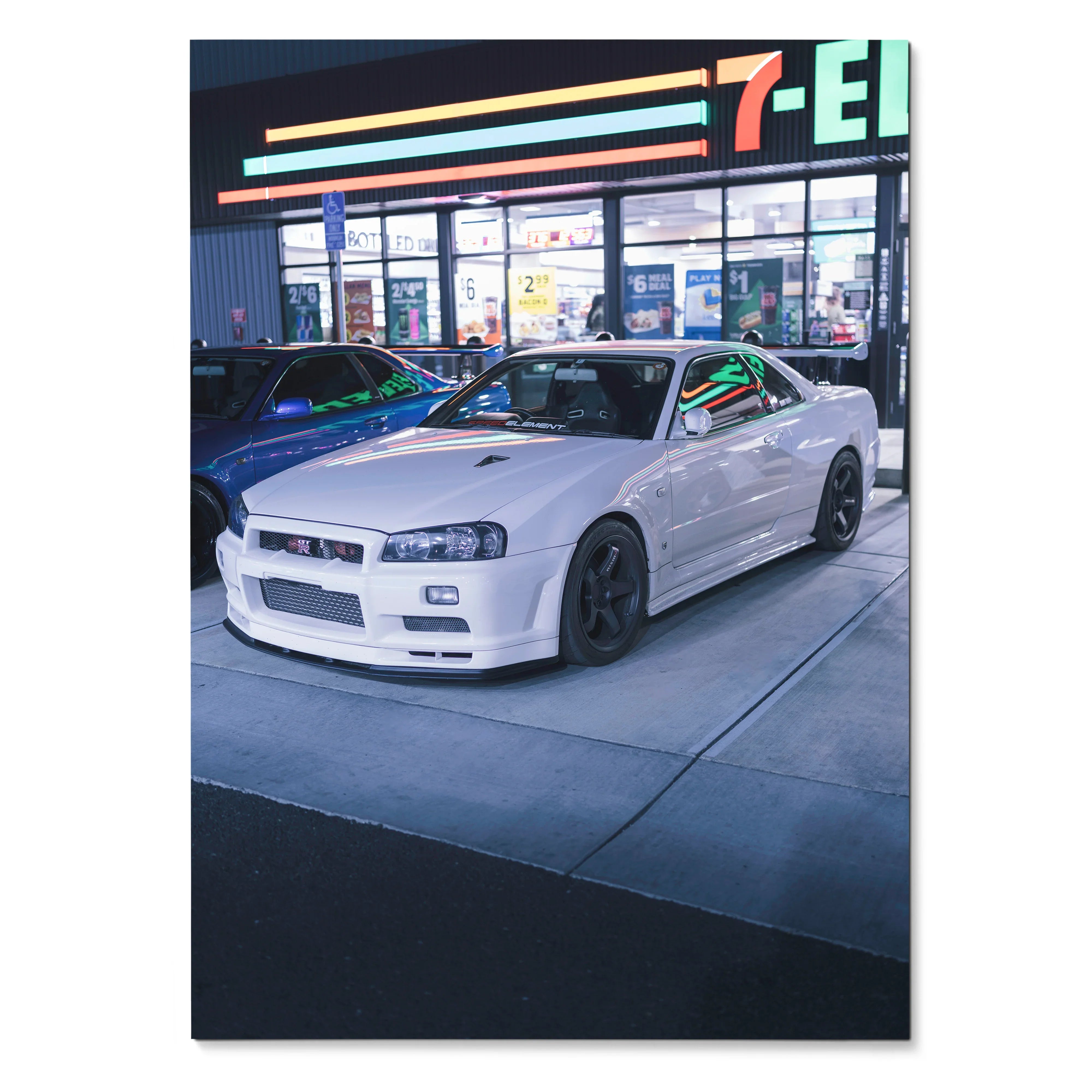 Nissan GTR R34 Skyline white sports car parked at night poster wall art.