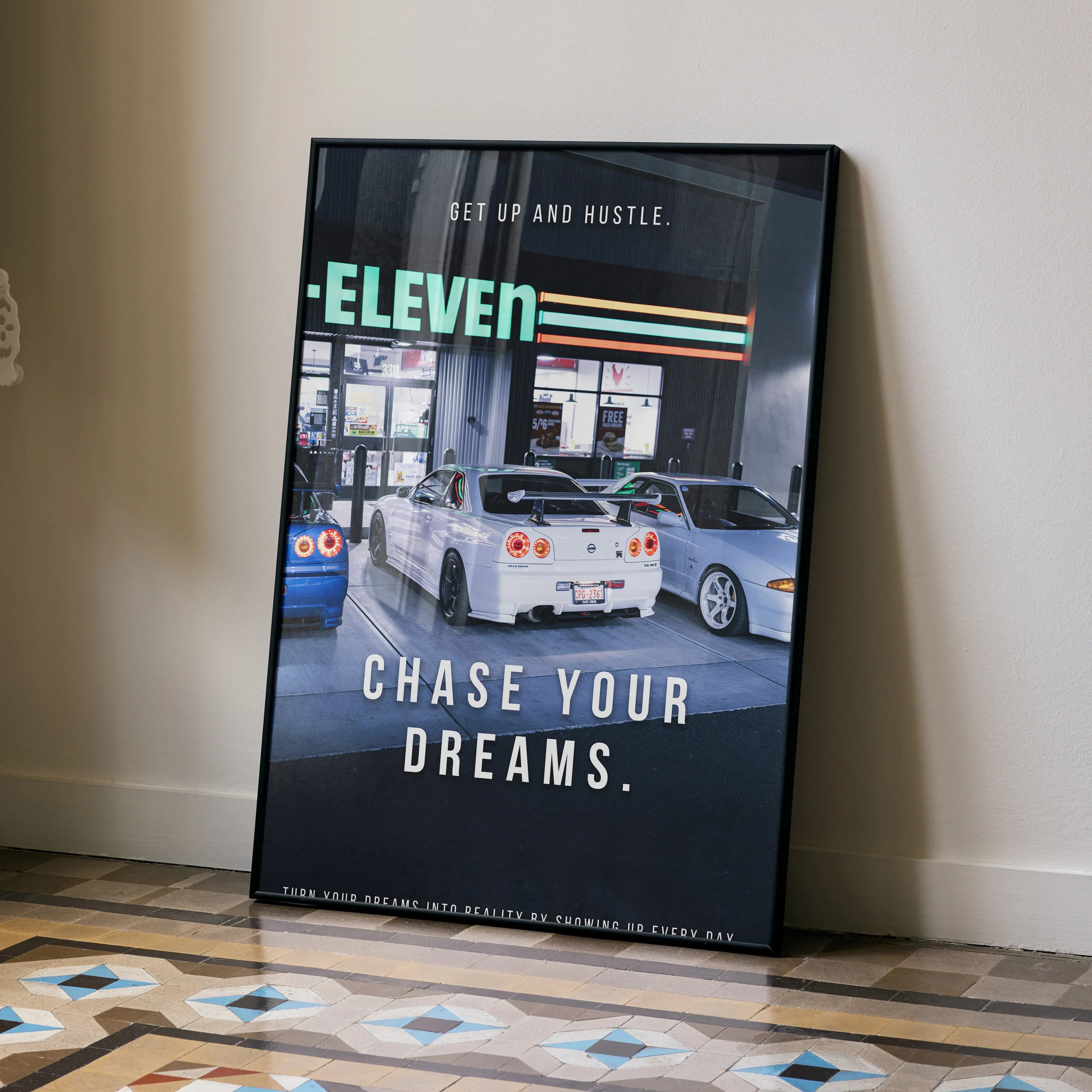 Motivational poster wall art featuring white Nissan GT-R R34 Skyline with inspiring text "Get Up and Hustle.