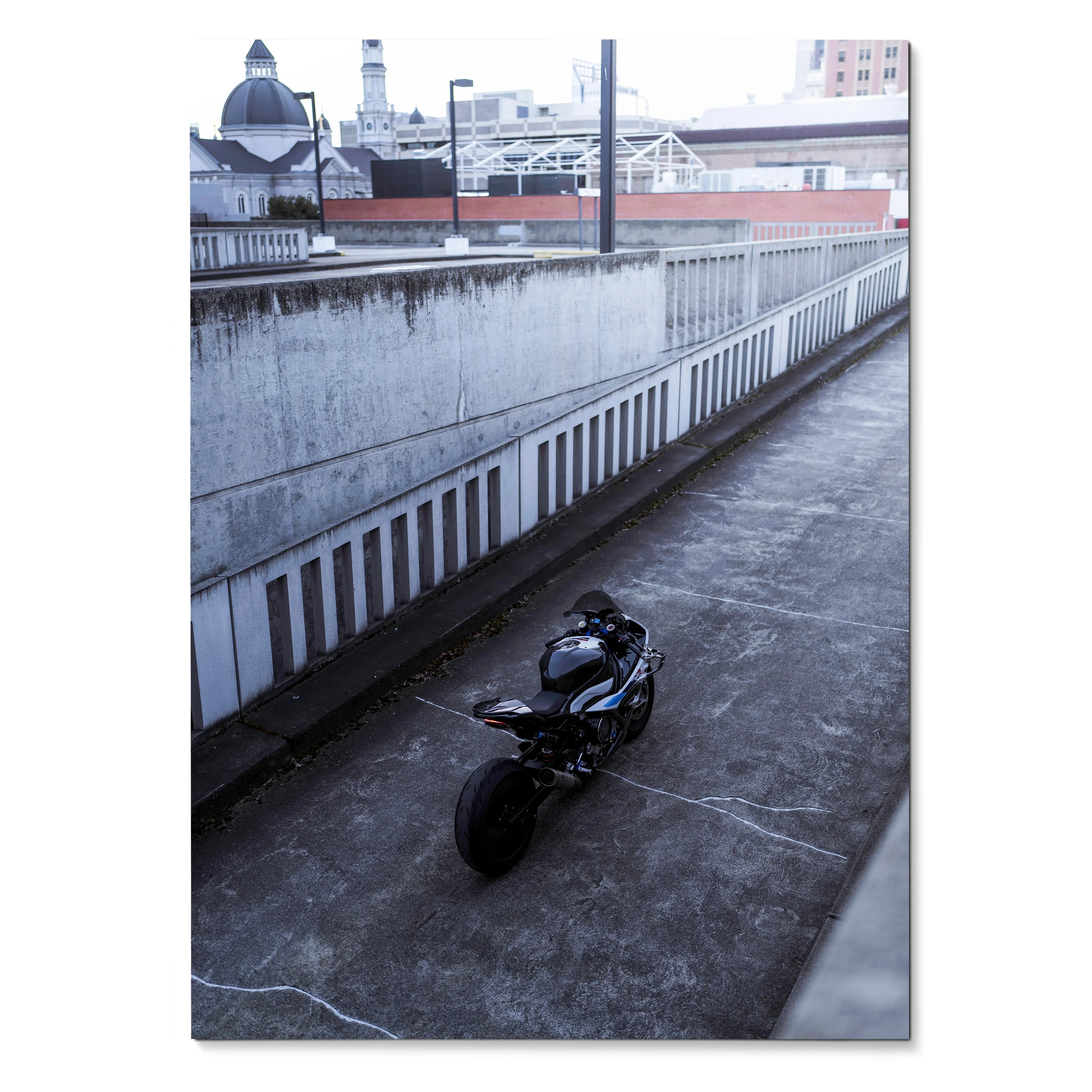 BMW S1000RR motorcycle parked on urban rooftop, poster wall art with sleek design and city background.