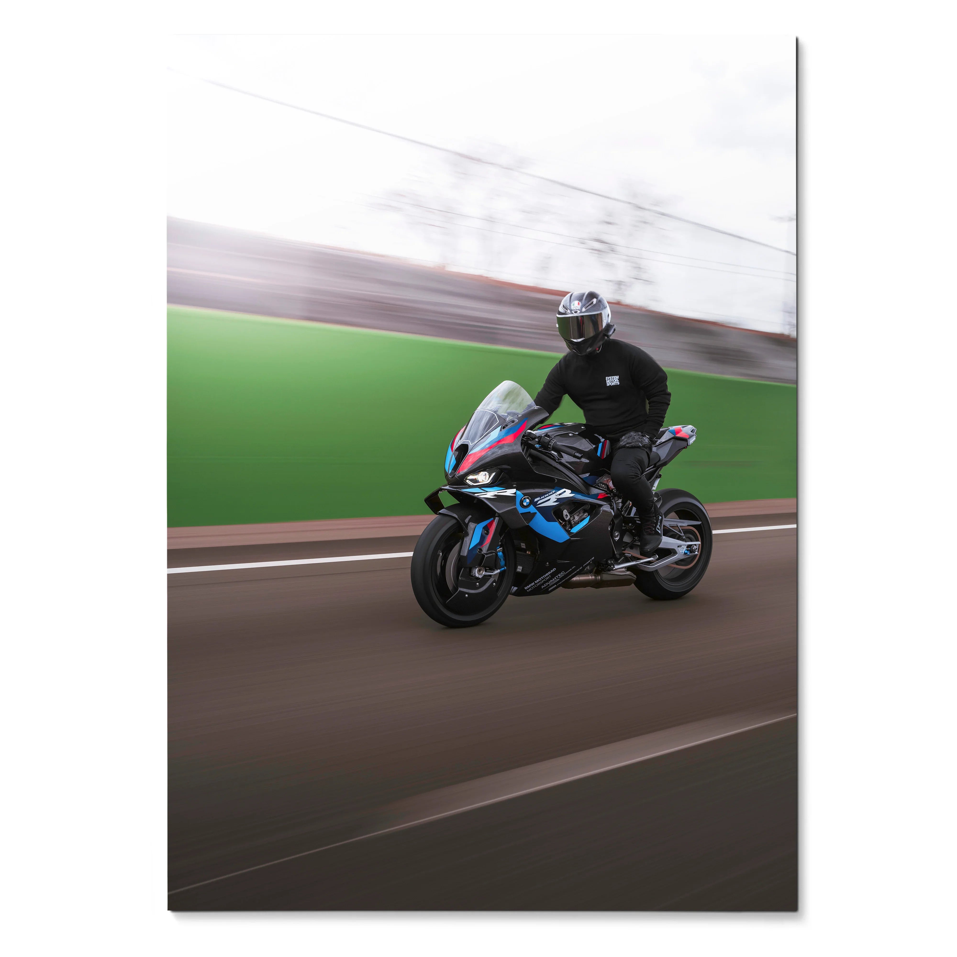 BMW M1000RR motorcycle poster with rider in black gear on racetrack wall art.