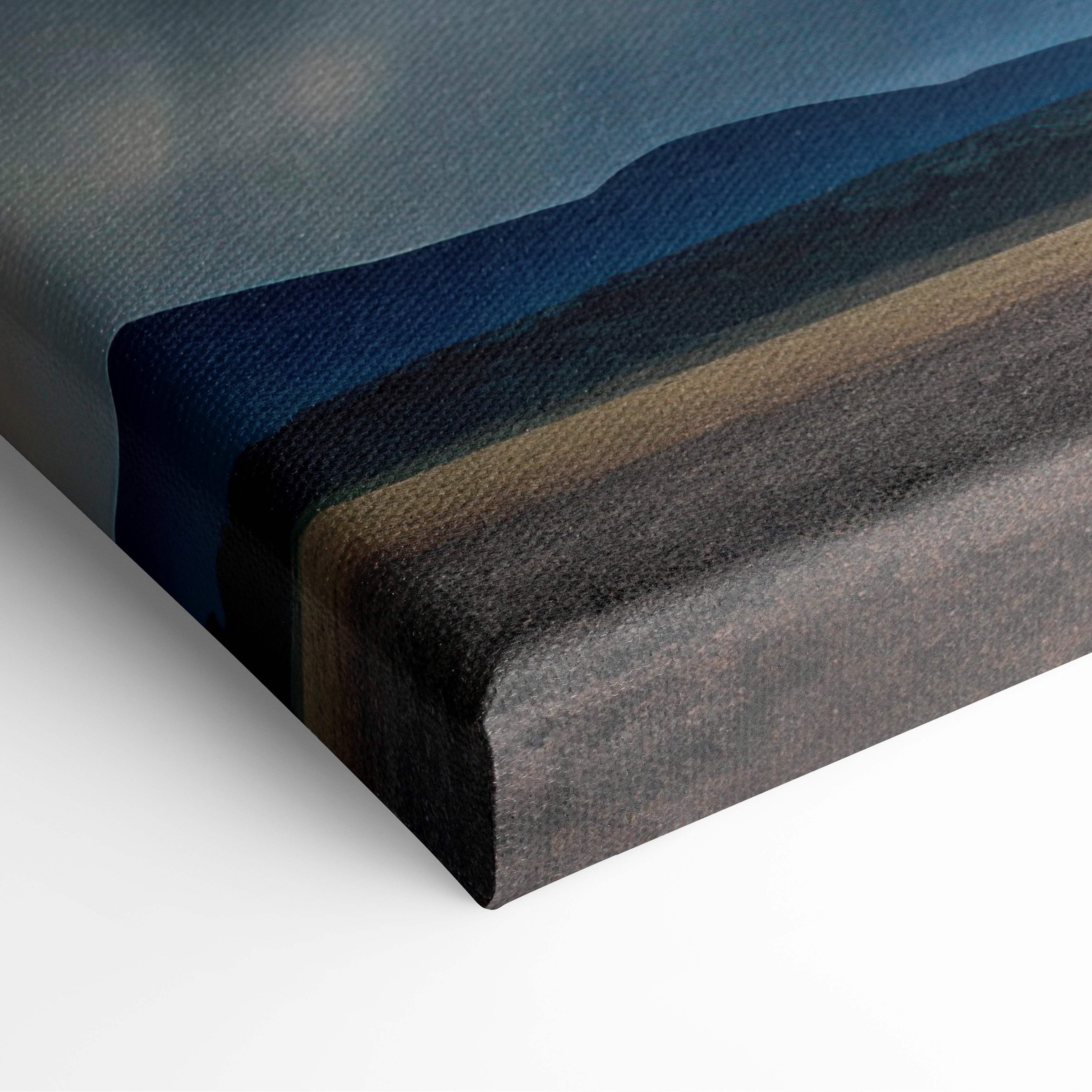 A stretched canvas print featuring a layered abstract landscape in deep blues grays and earthy browns for wall decor