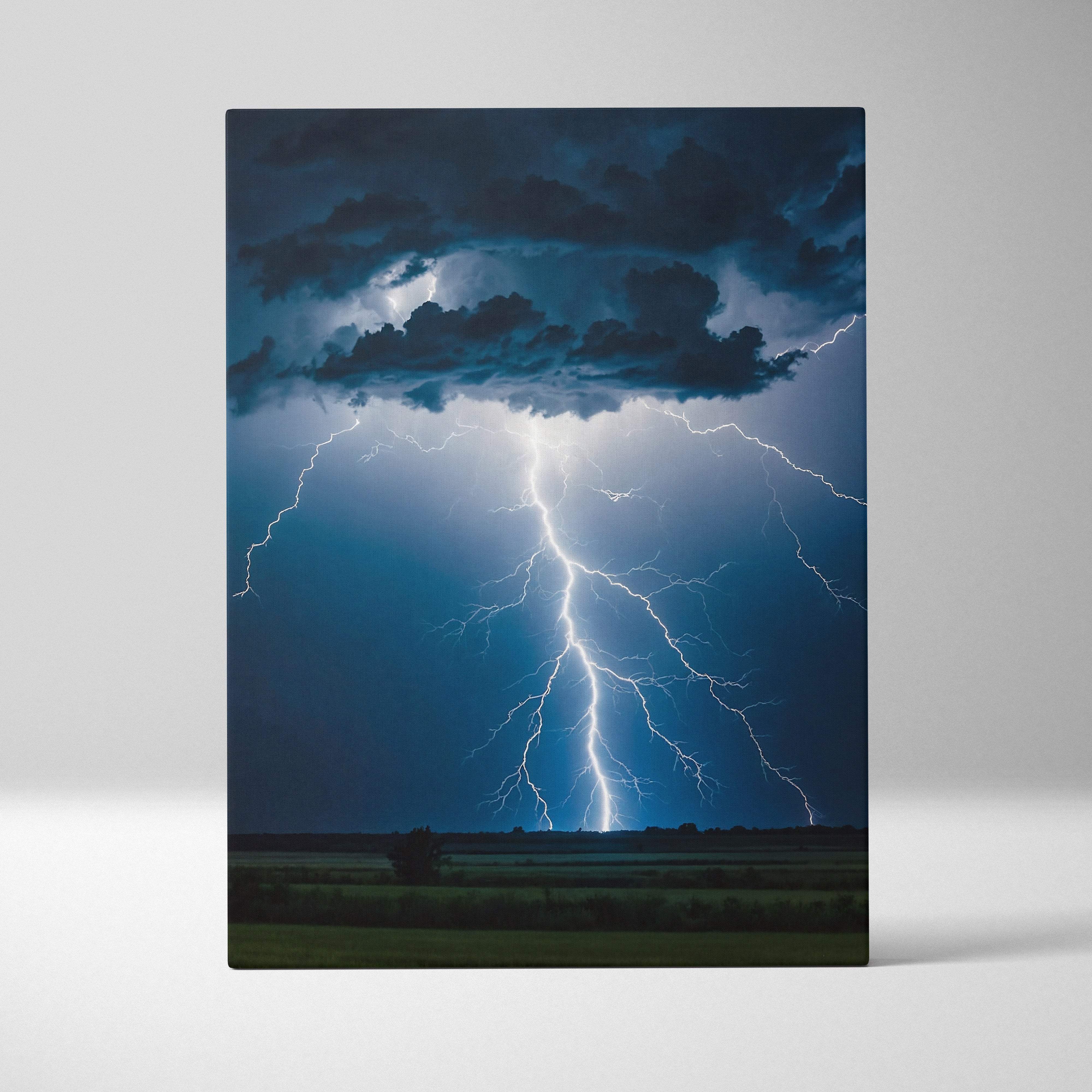 A dramatic canvas print showing a powerful cloud-to-ground lightning strike under dark storm clouds at night