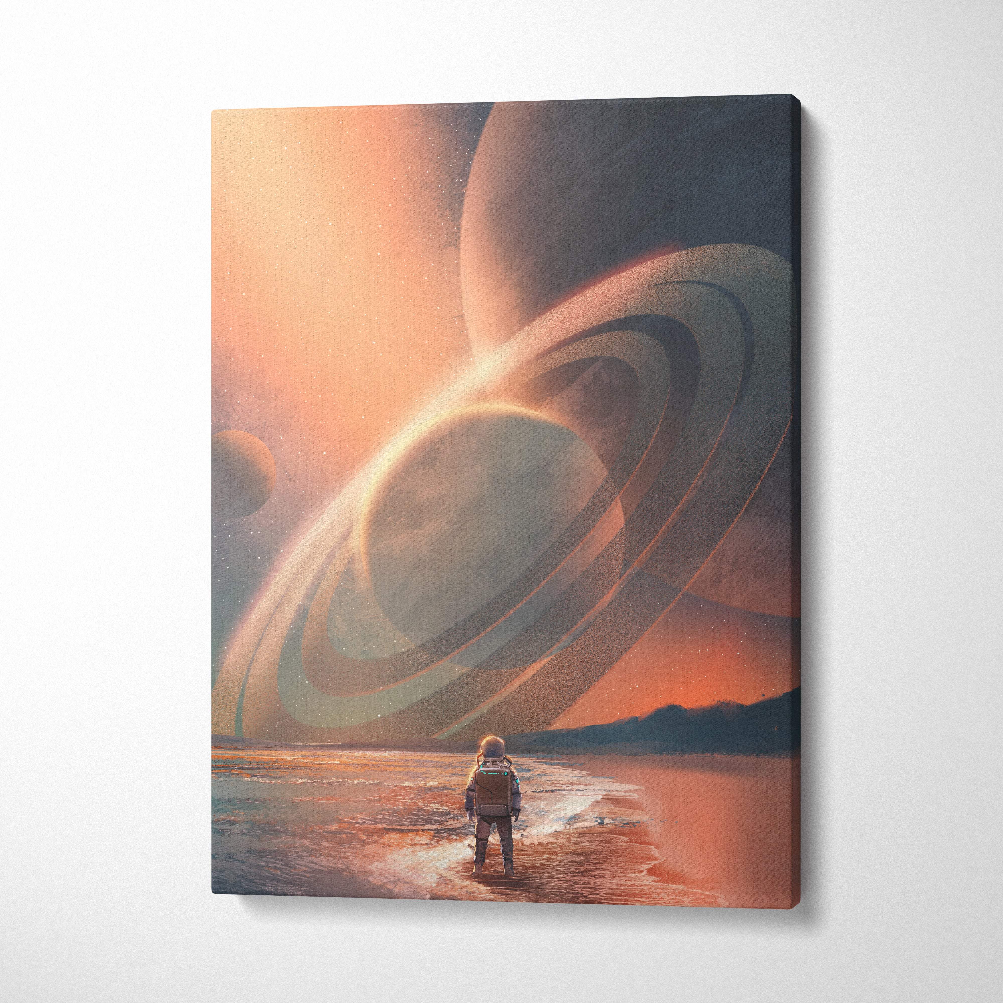 A surreal canvas print of an astronaut on an alien beach with giant ringed planets under an orange pink sky