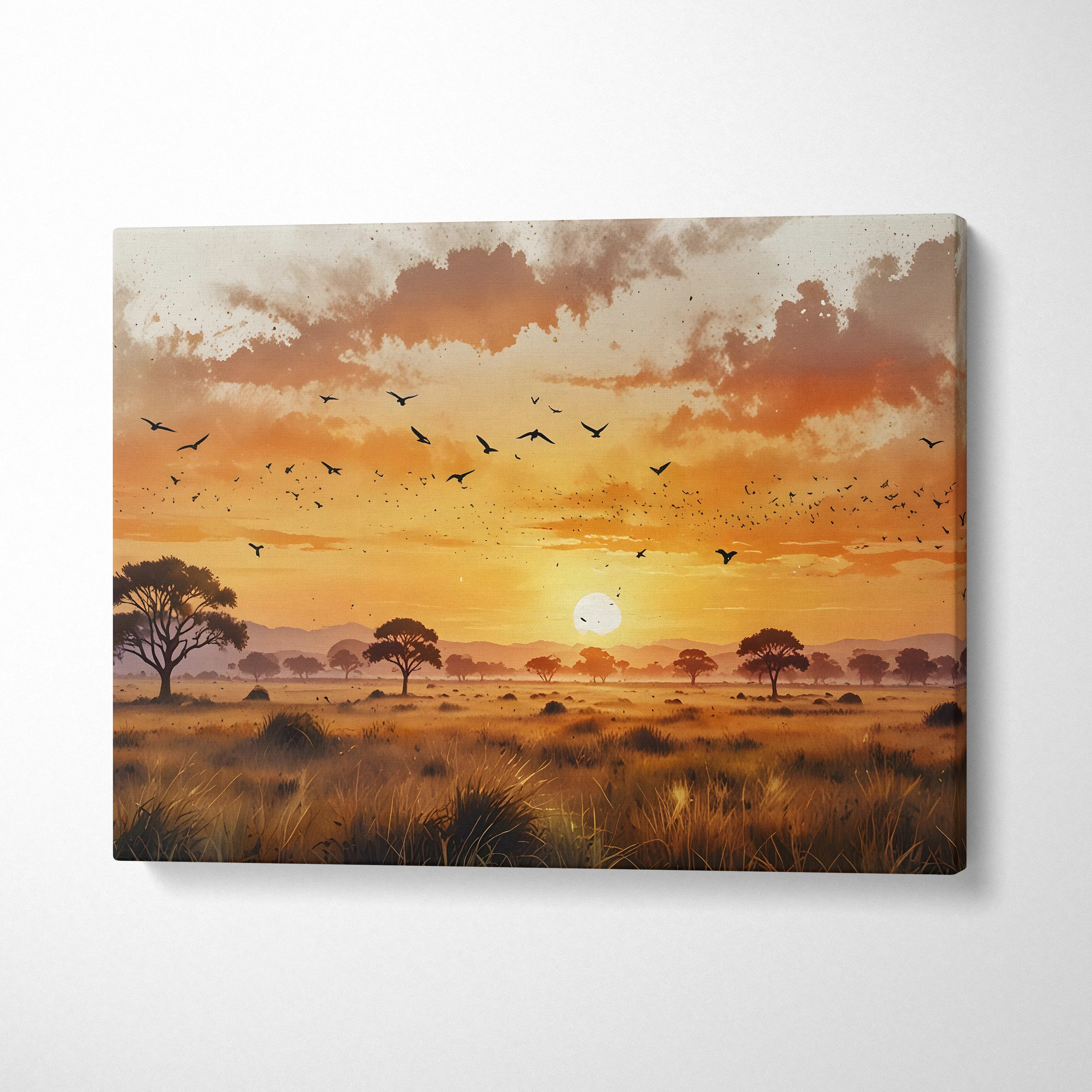 Canvas wall art of a vivid watercolor sunset with flying birds and silhouetted trees over grassland.