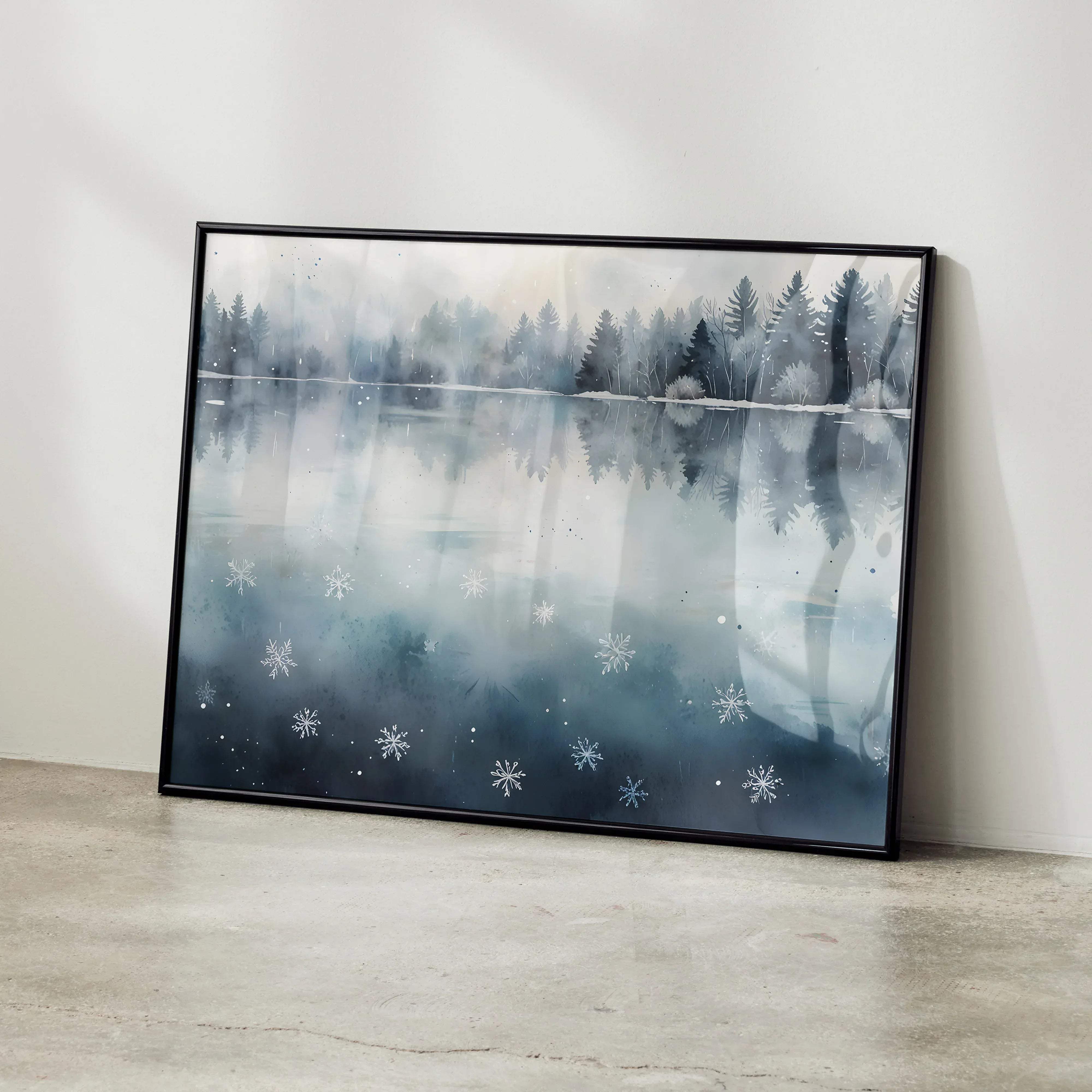 Black-framed watercolor art poster featuring a misty winter lake with snowflake accents and serene nature scene