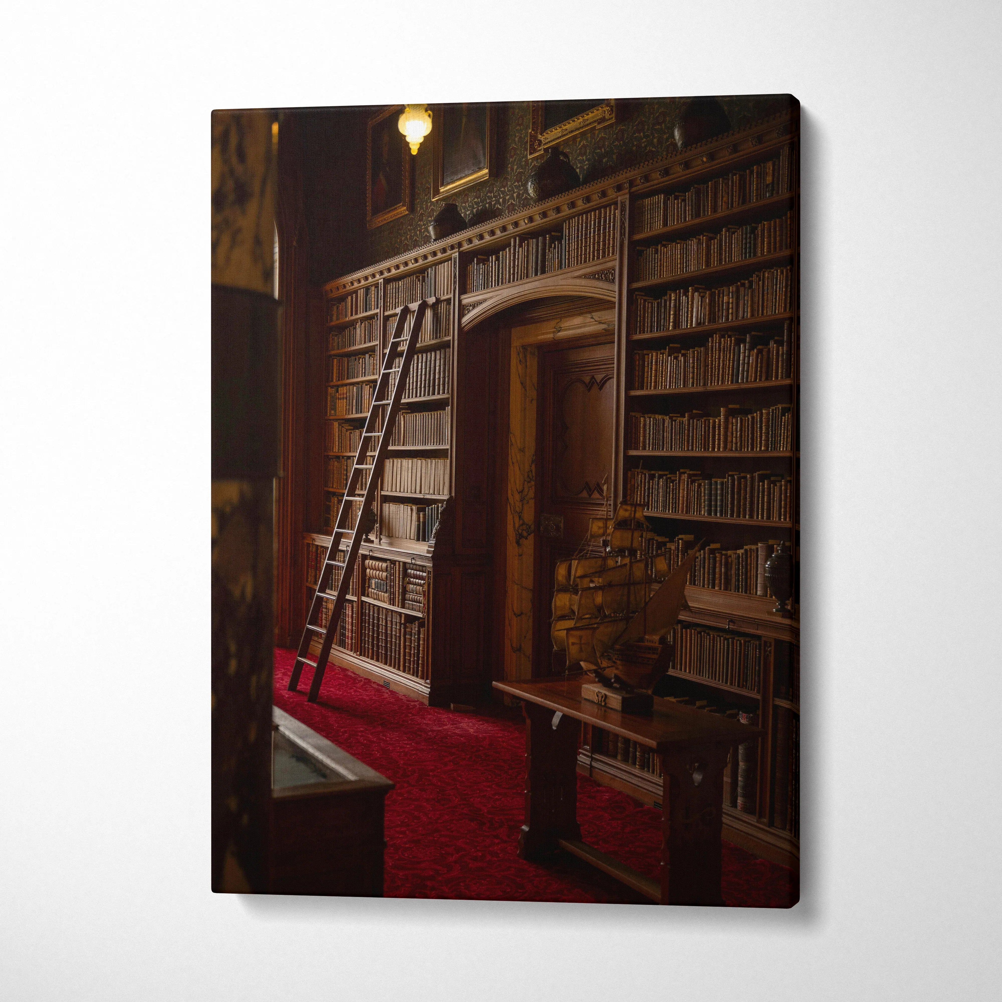 Canvas wall art featuring a vintage library with tall wooden bookshelves and a rolling ladder on red carpet.