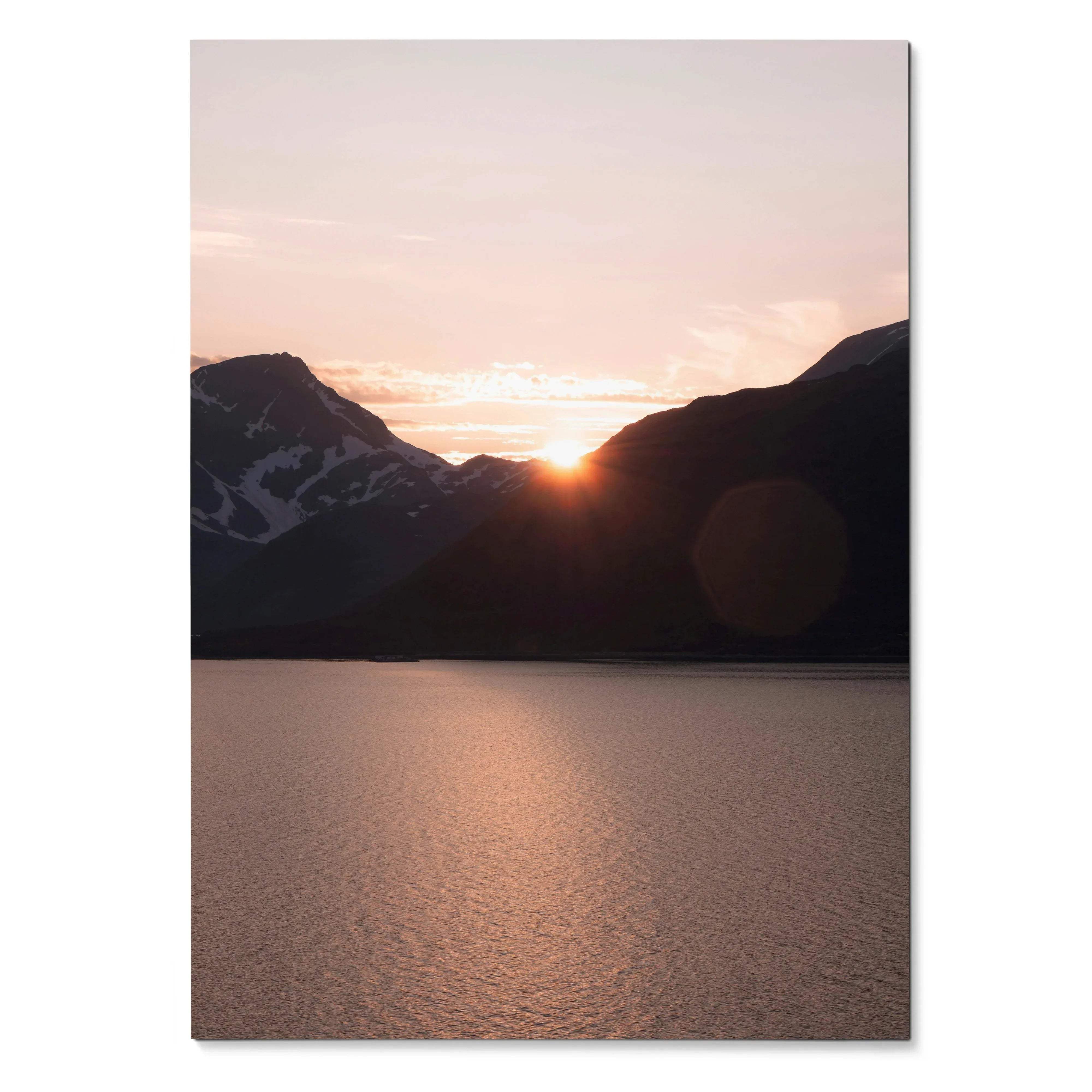 Sunset over mountain silhouettes reflecting on calm water poster wall art.
